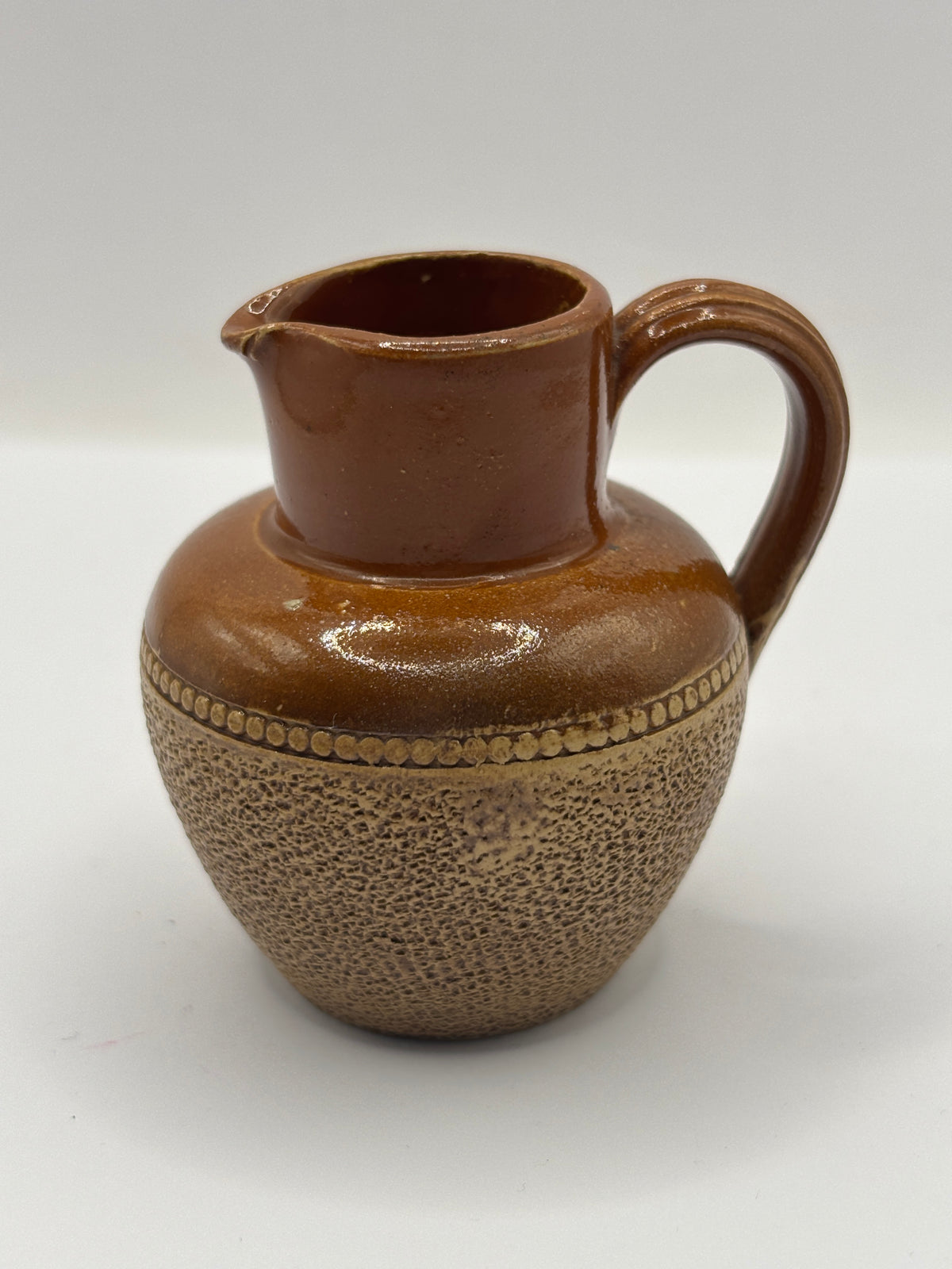 Old mini stoneware handled jug