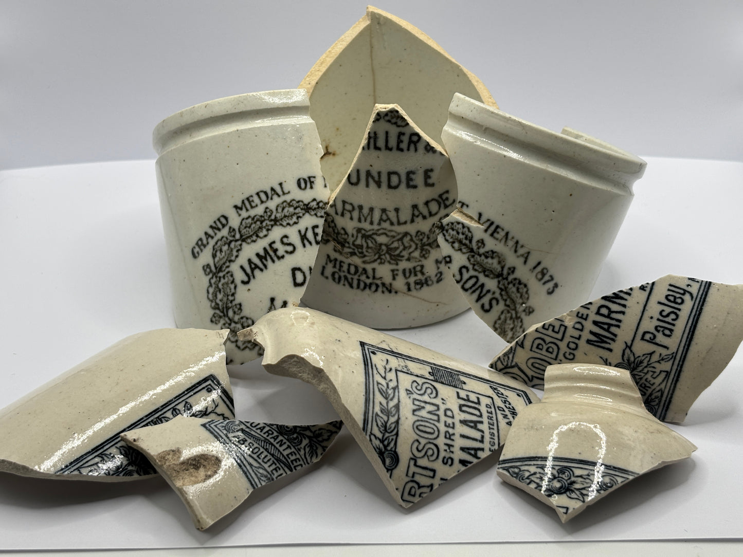 Old stoneware advertising shards/bits
