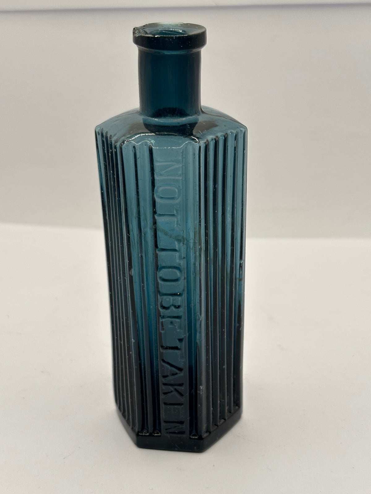old blue glass ribbed poison bottle, not to be taken. Unusual colour