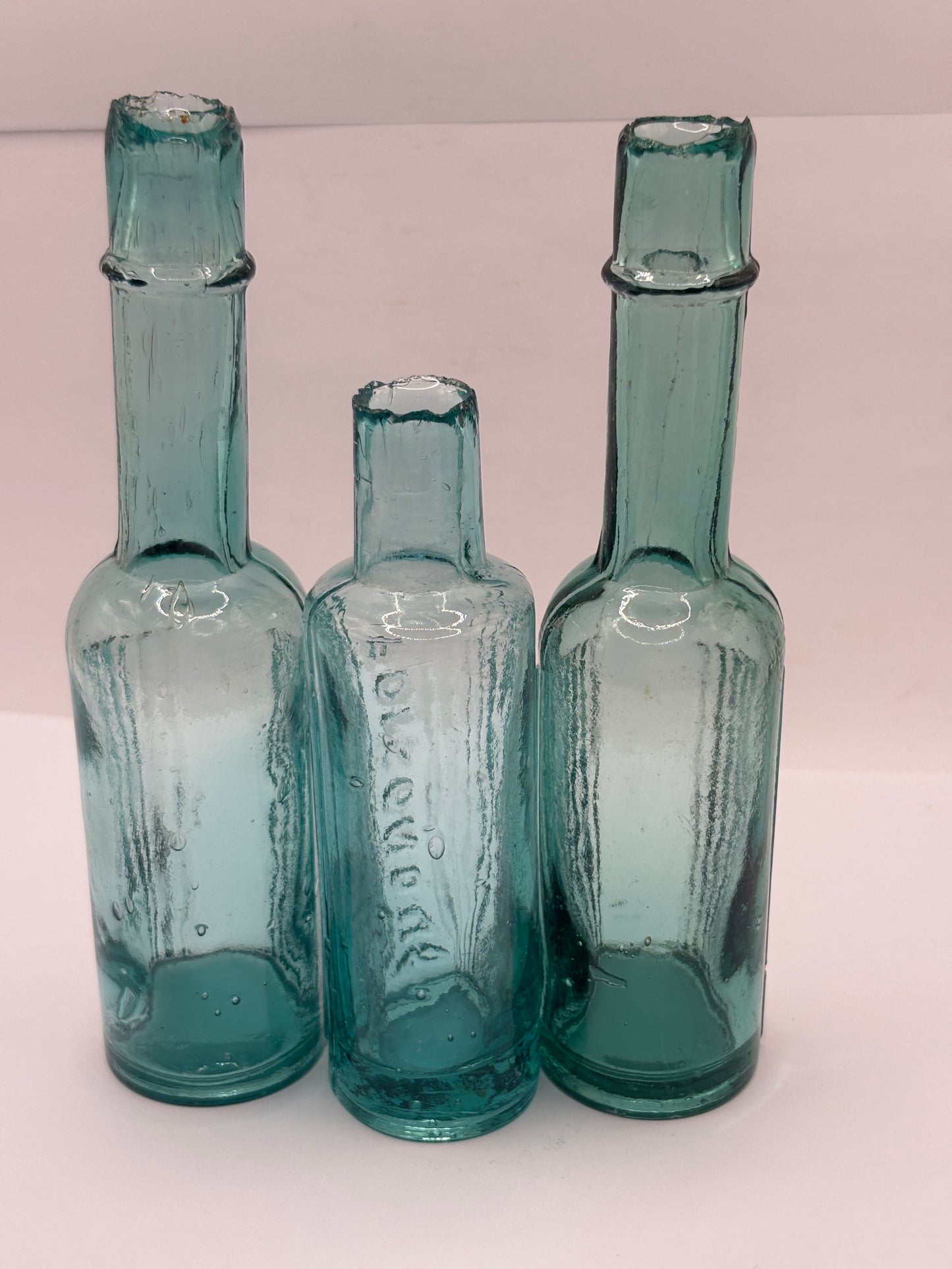 3 Old aqua glass poison bottles, poisonous