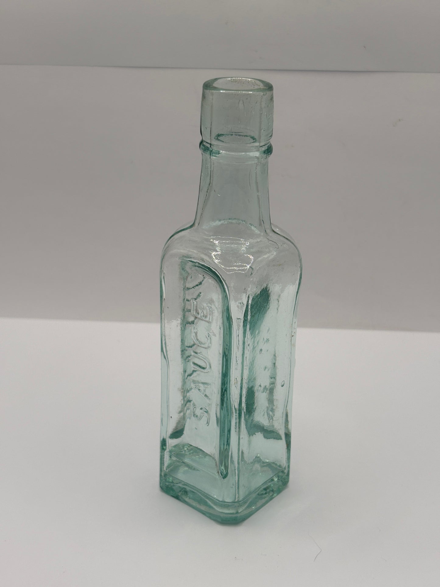 old aqua glass sauce bottle, Grannys delicious sauce