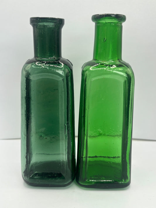 2 old green Izal bottles