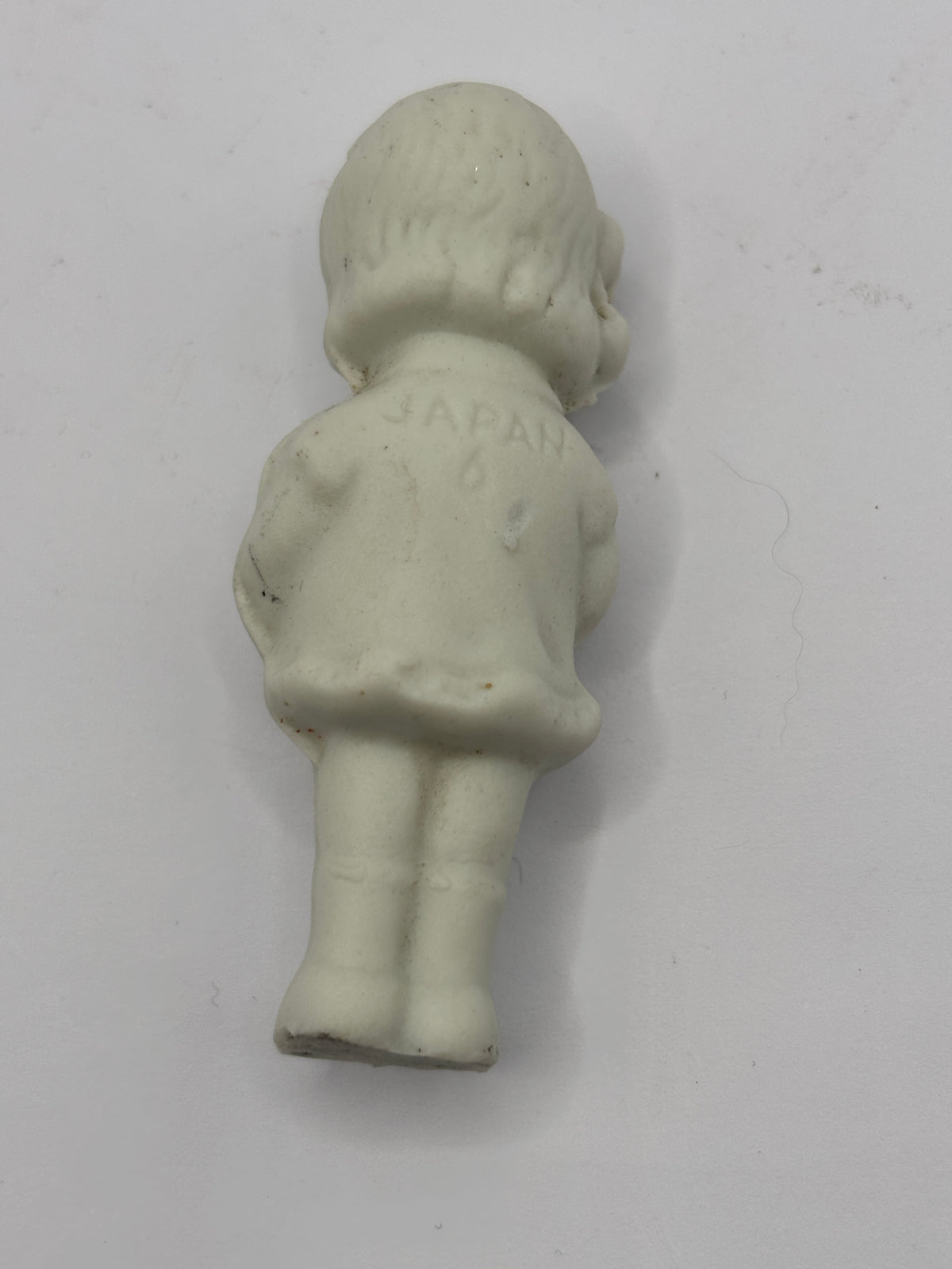 Old mini stoneware doll