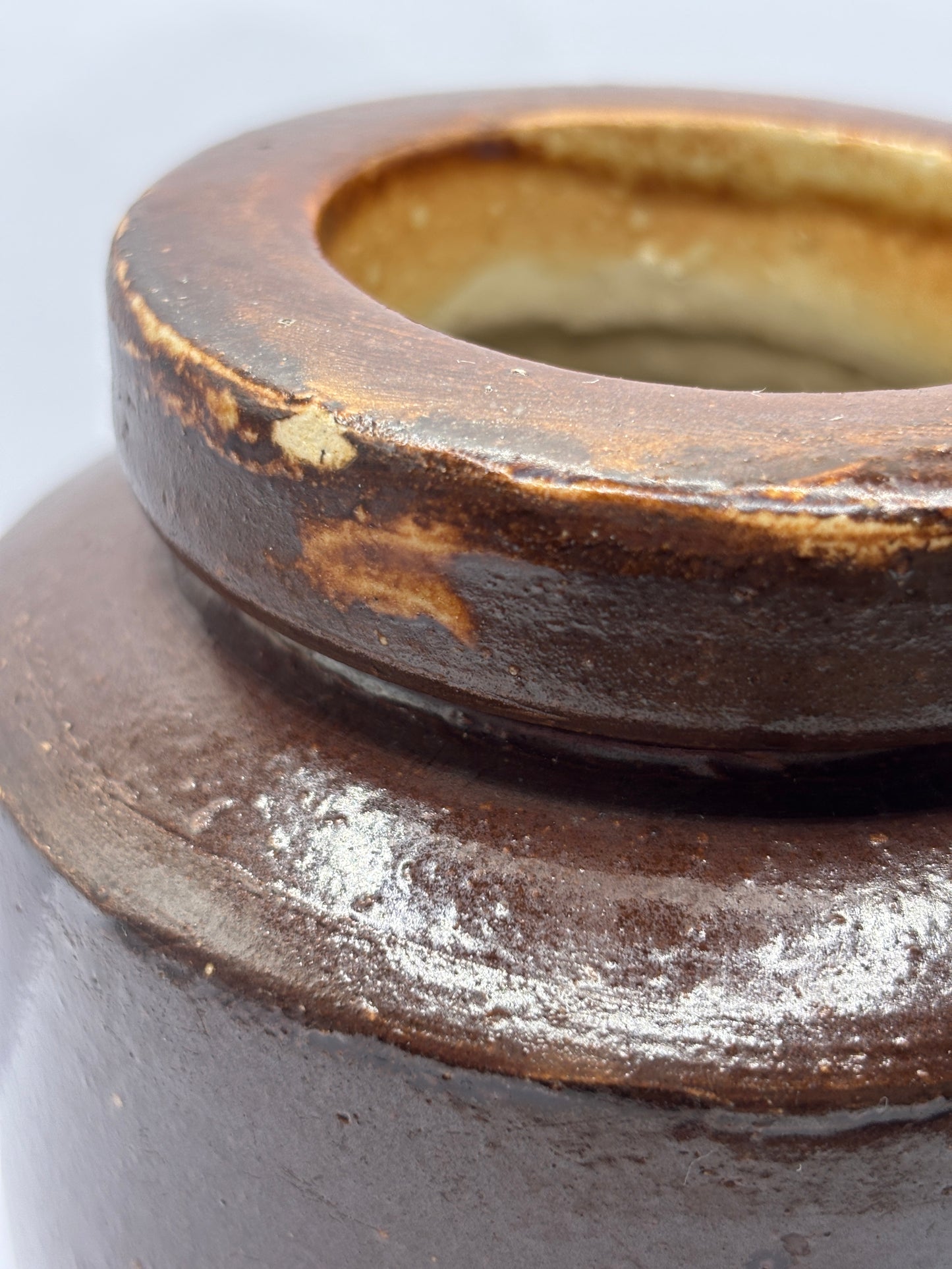 Old brown stoneware jar