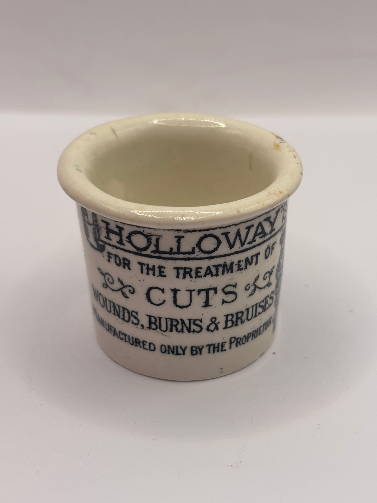 Old advertising ointment pot, Holloways ointment. Small chip
