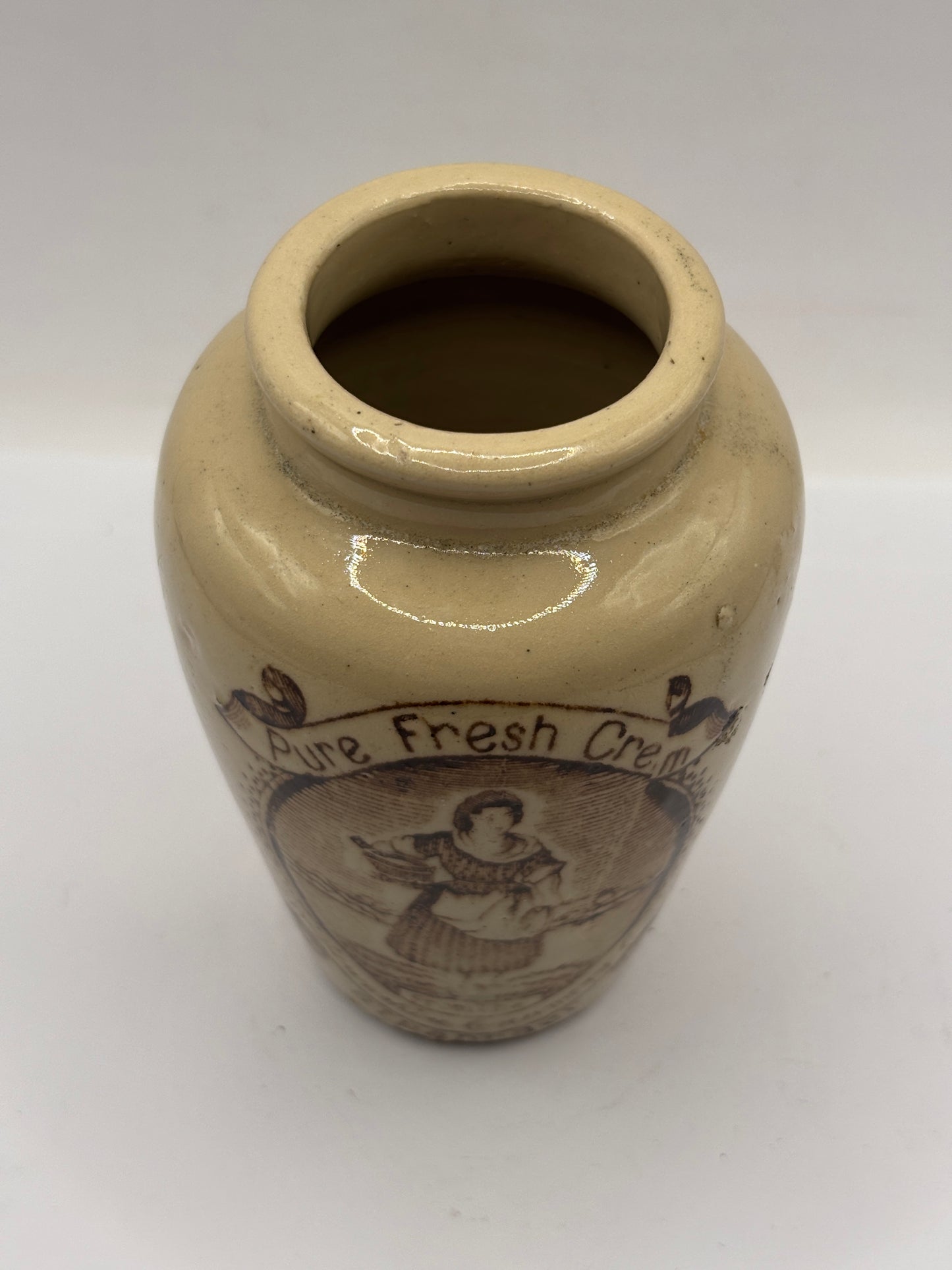 Old stoneware advertising cream pot, pure fresh cream Stranraer. Serpia print