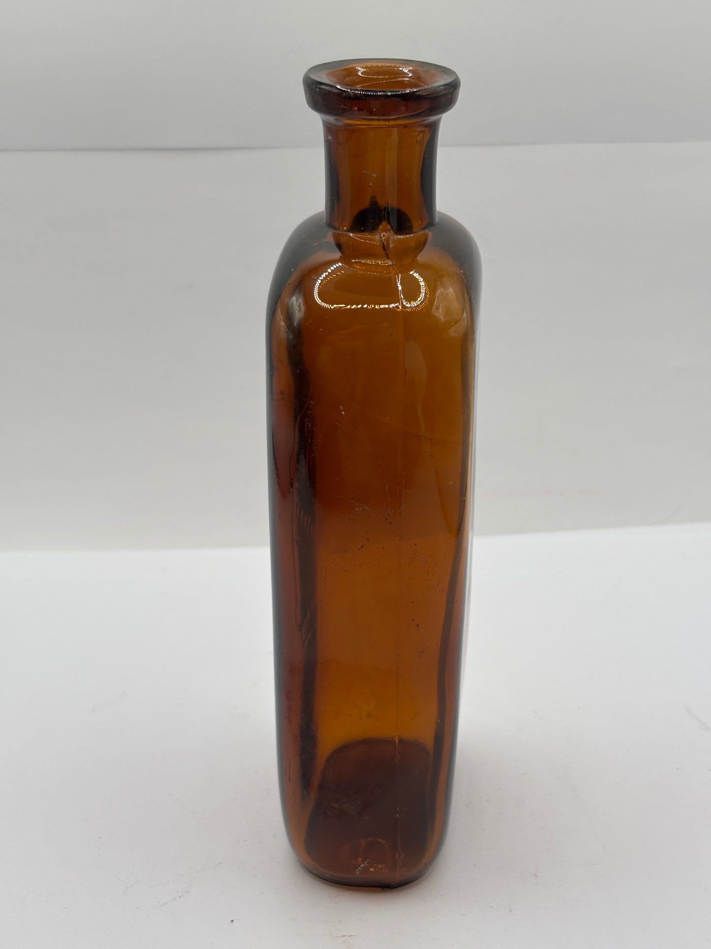 Old amber glass chemist bottle