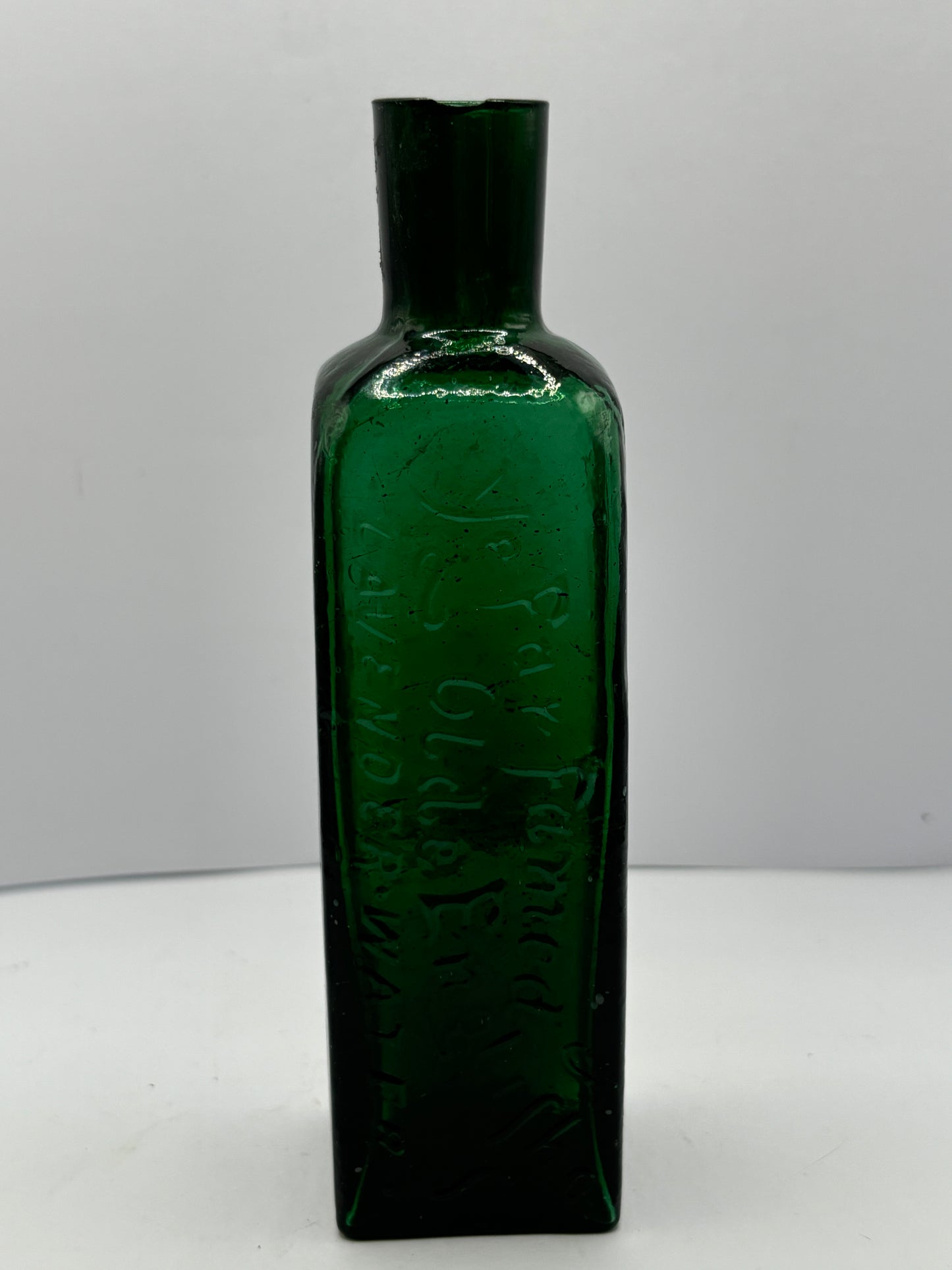 Old green advertising lavender water bottle, Ye far famed olde english lavender water