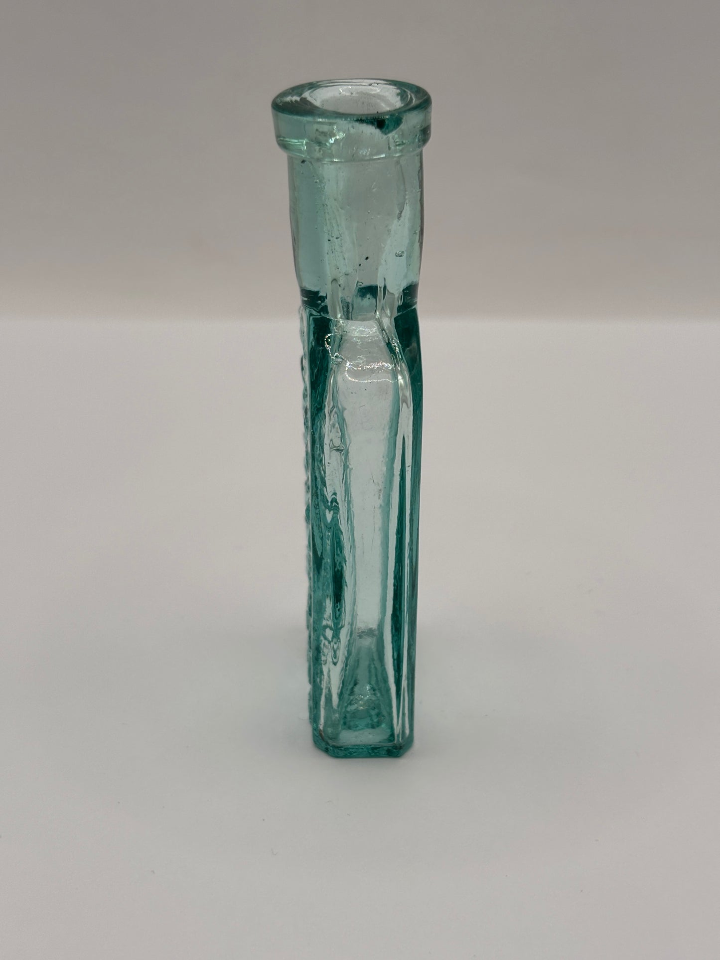 Old aqua glass advertising bottle. Try Pritchards teething powders
