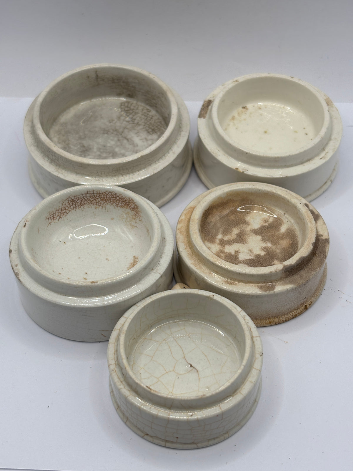 5 old stoneware pot lid bases, stackers (J)