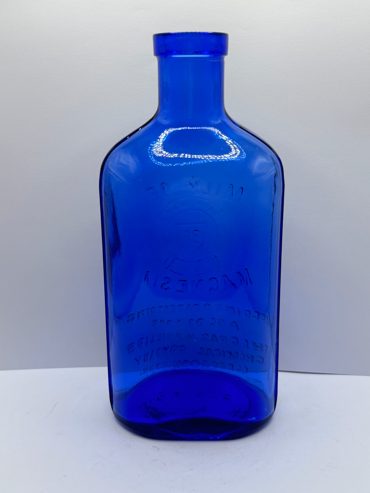 Old blue milk of magnesia bottle