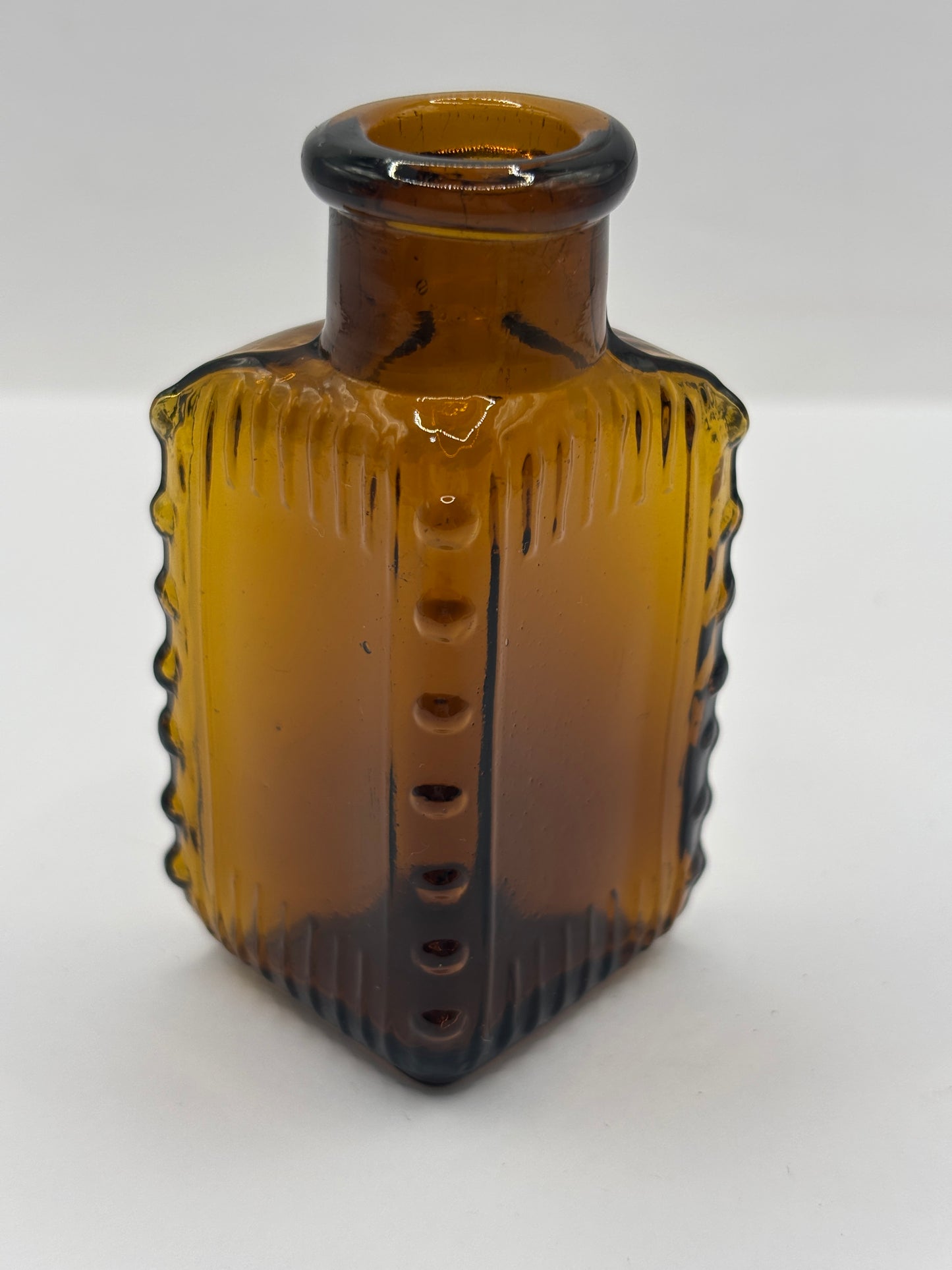 Old amber glass poison bottle