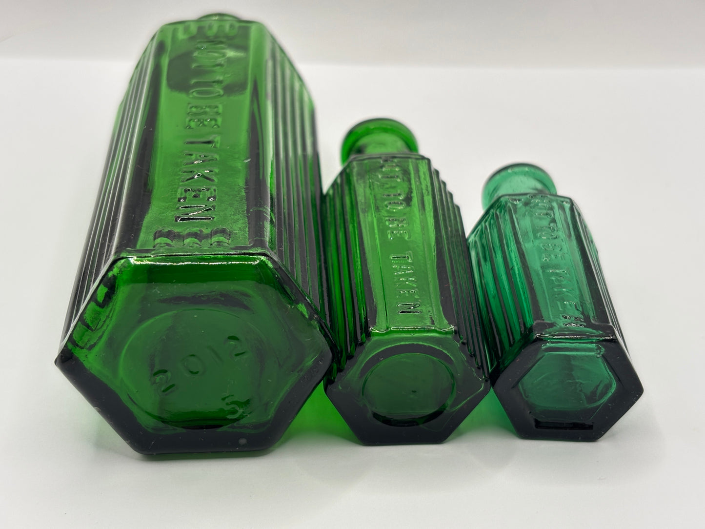3 Old green glass poison bottles, not to be taken