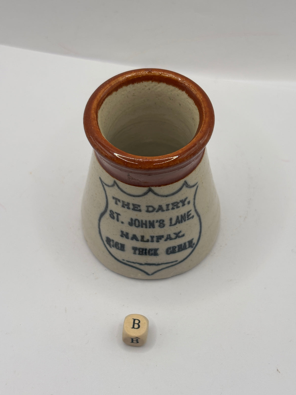Old advertising cream pot, The dairy, Johns lane, Halifax (B)