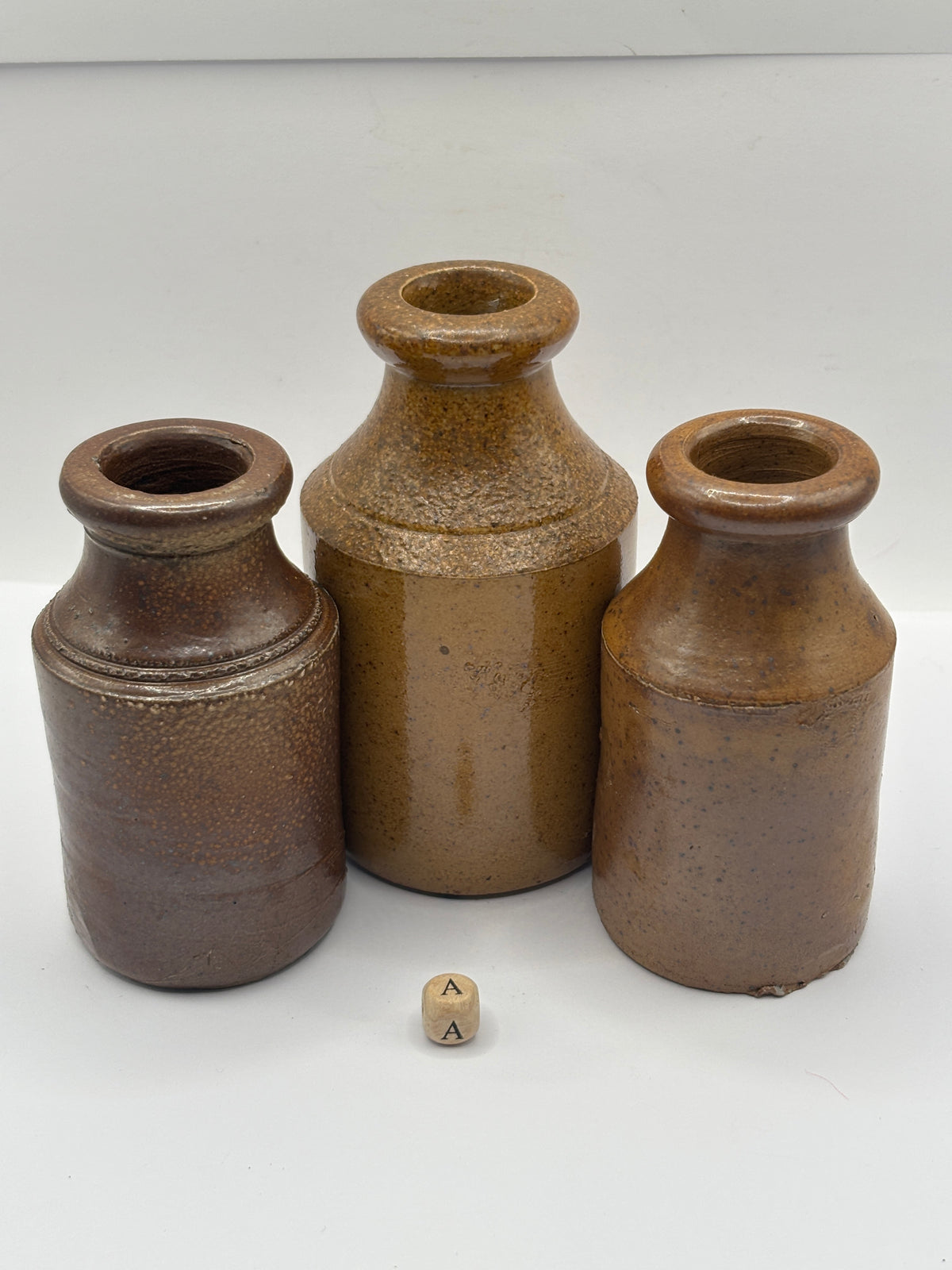 3 tall brown stoneware pots (a)