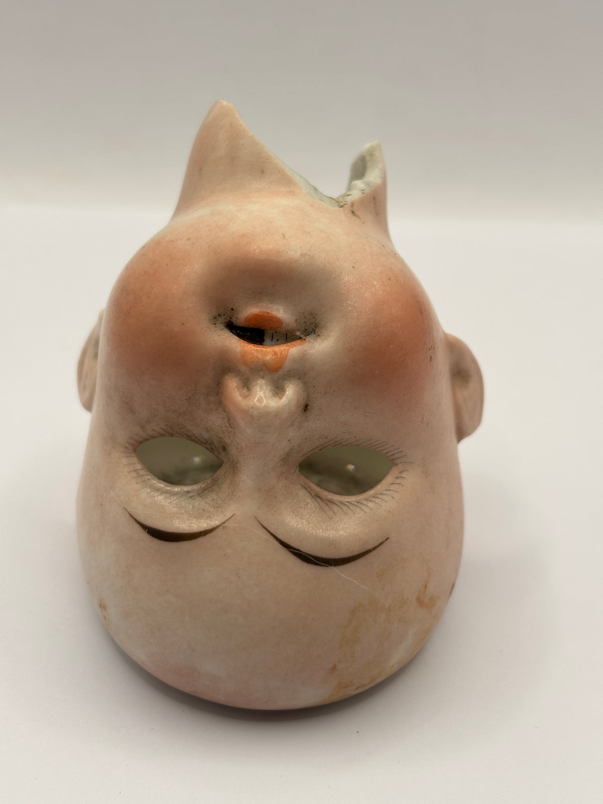 Old bisque dolls head, damaged