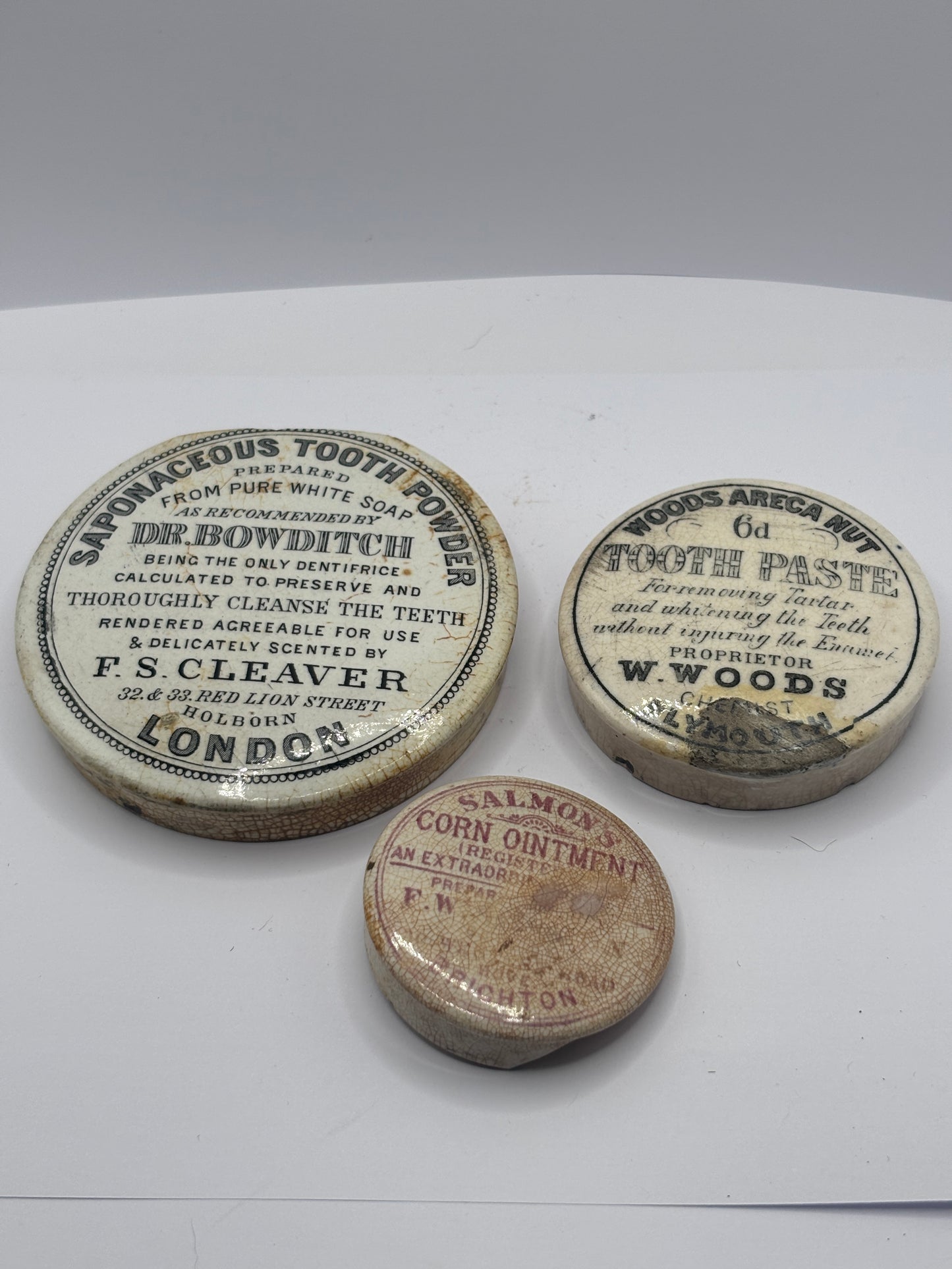3 old damaged advertising lids