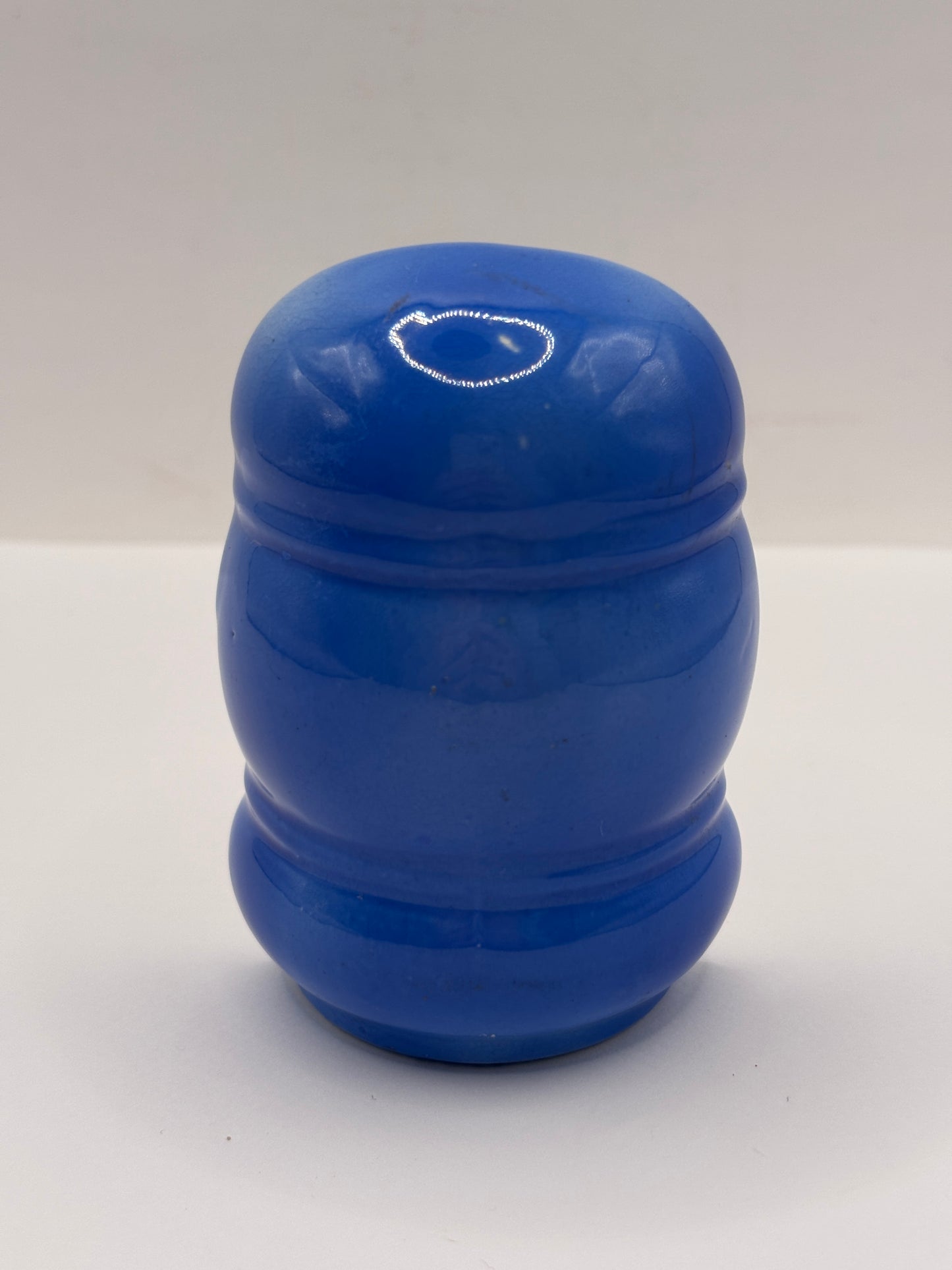Old blue ceramic bird feeder