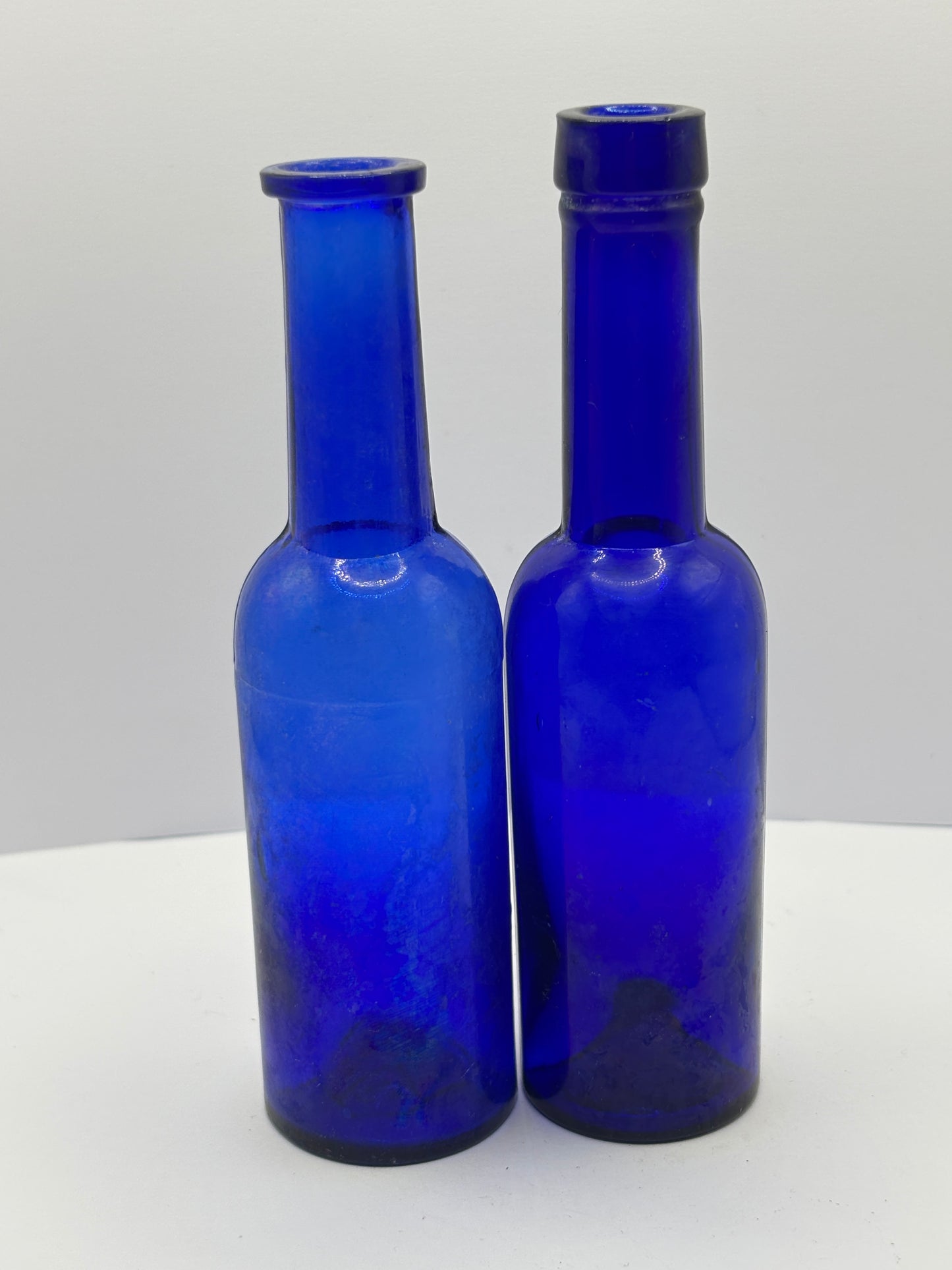 2 old blue castor oil bottles