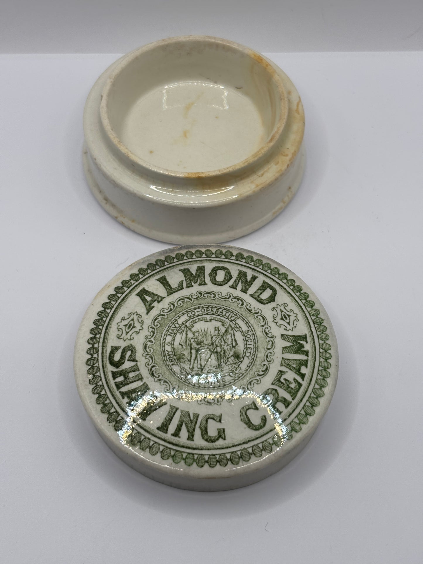 Old green print advertising lid and base, Almond shaving cream