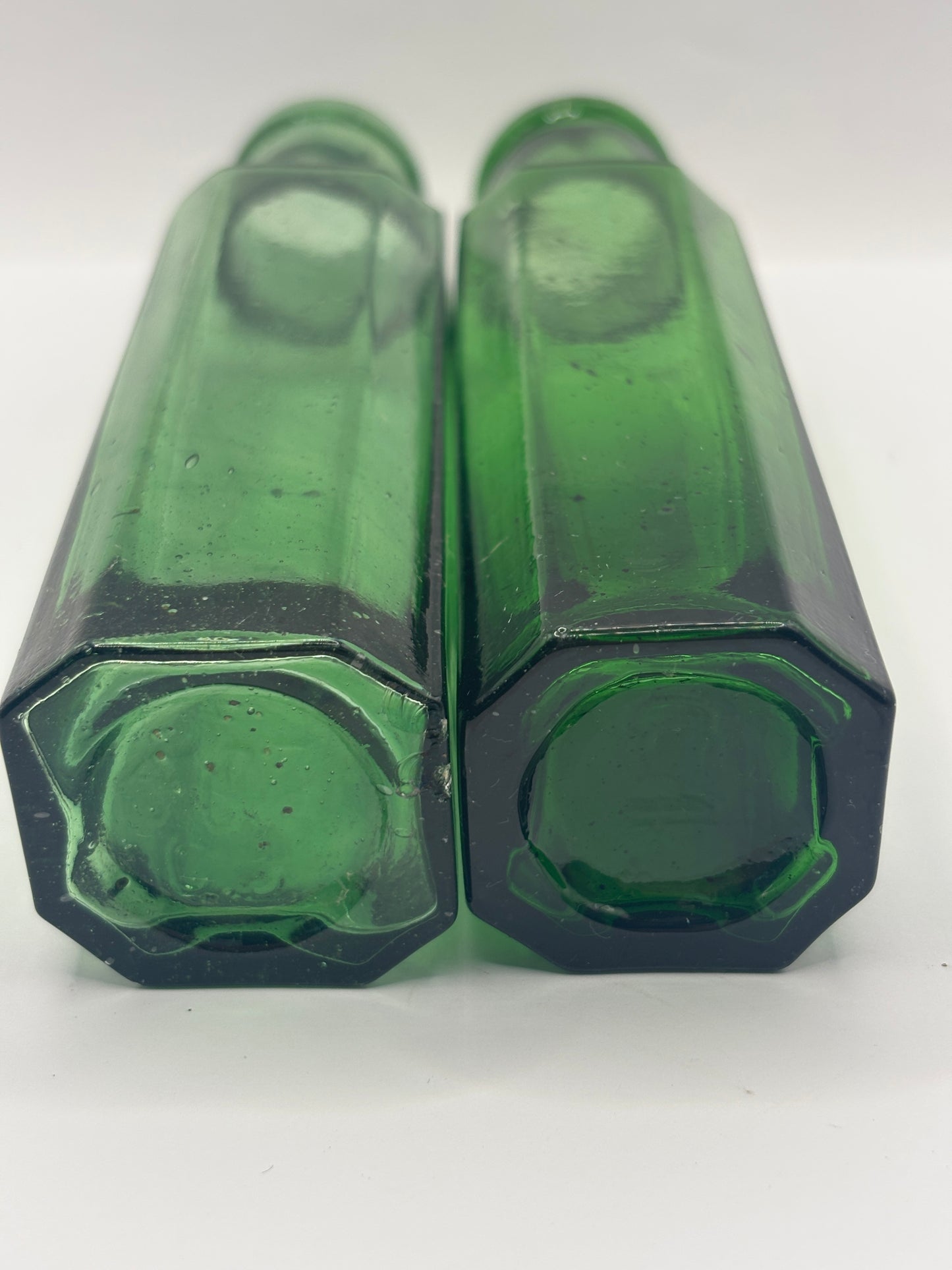 2 old green glass bottles