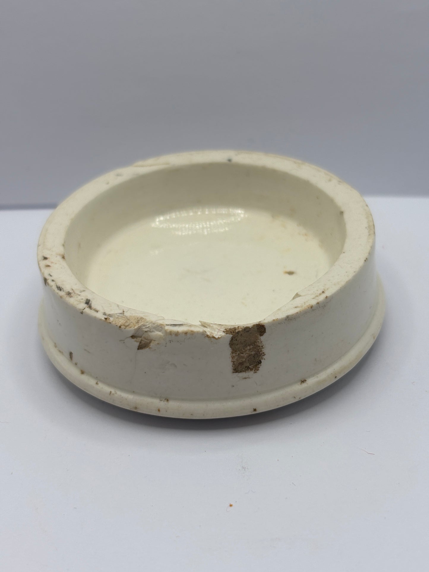 Old advertising lid, woods areca nut toothpaste lid. Damaged