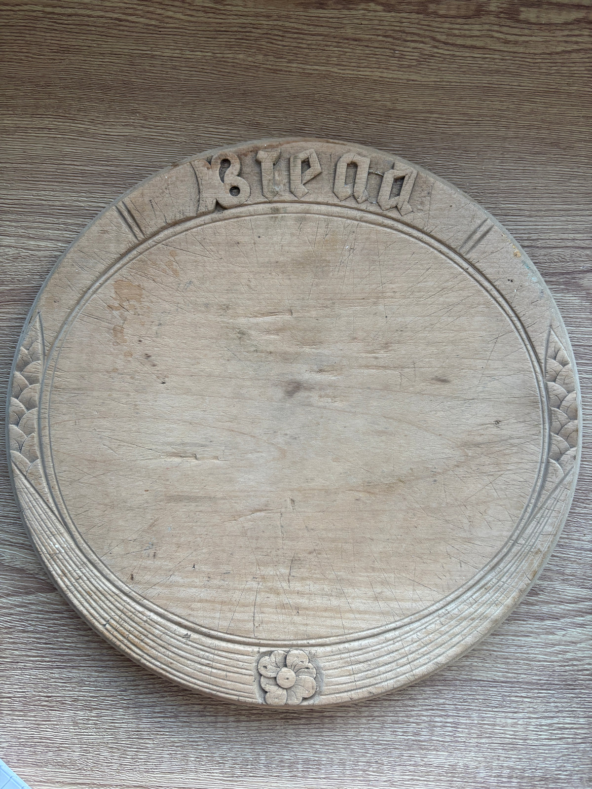 Old wooden carved bread board