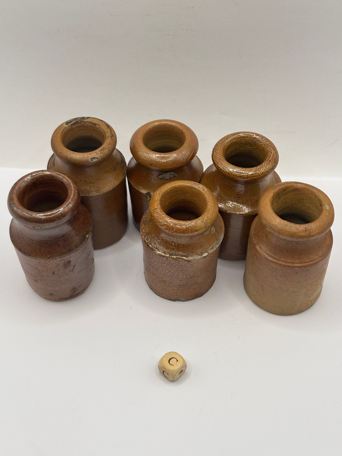 6 small brown stoneware pots (c)