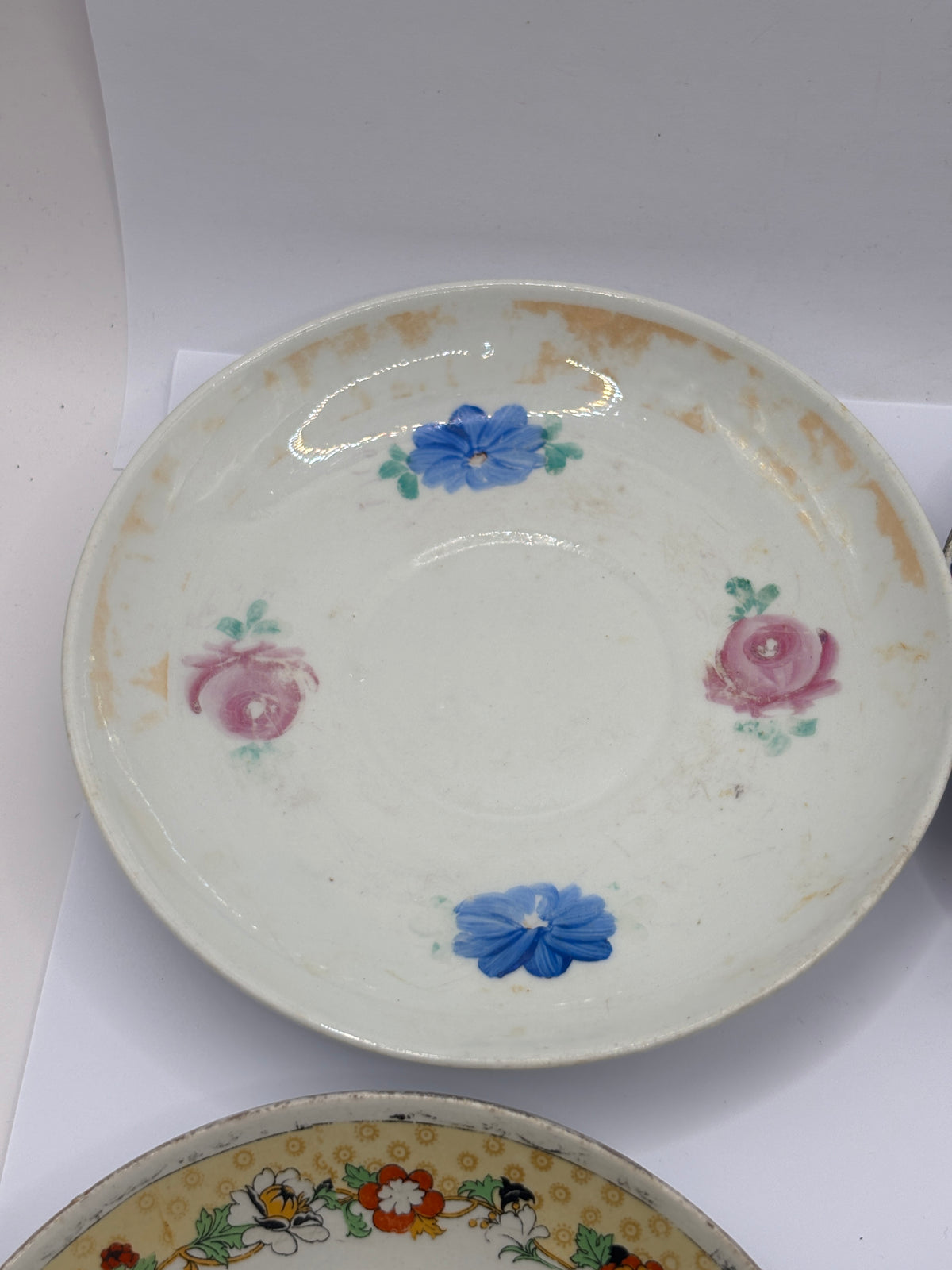 4 old decorative saucers (all dump dug)