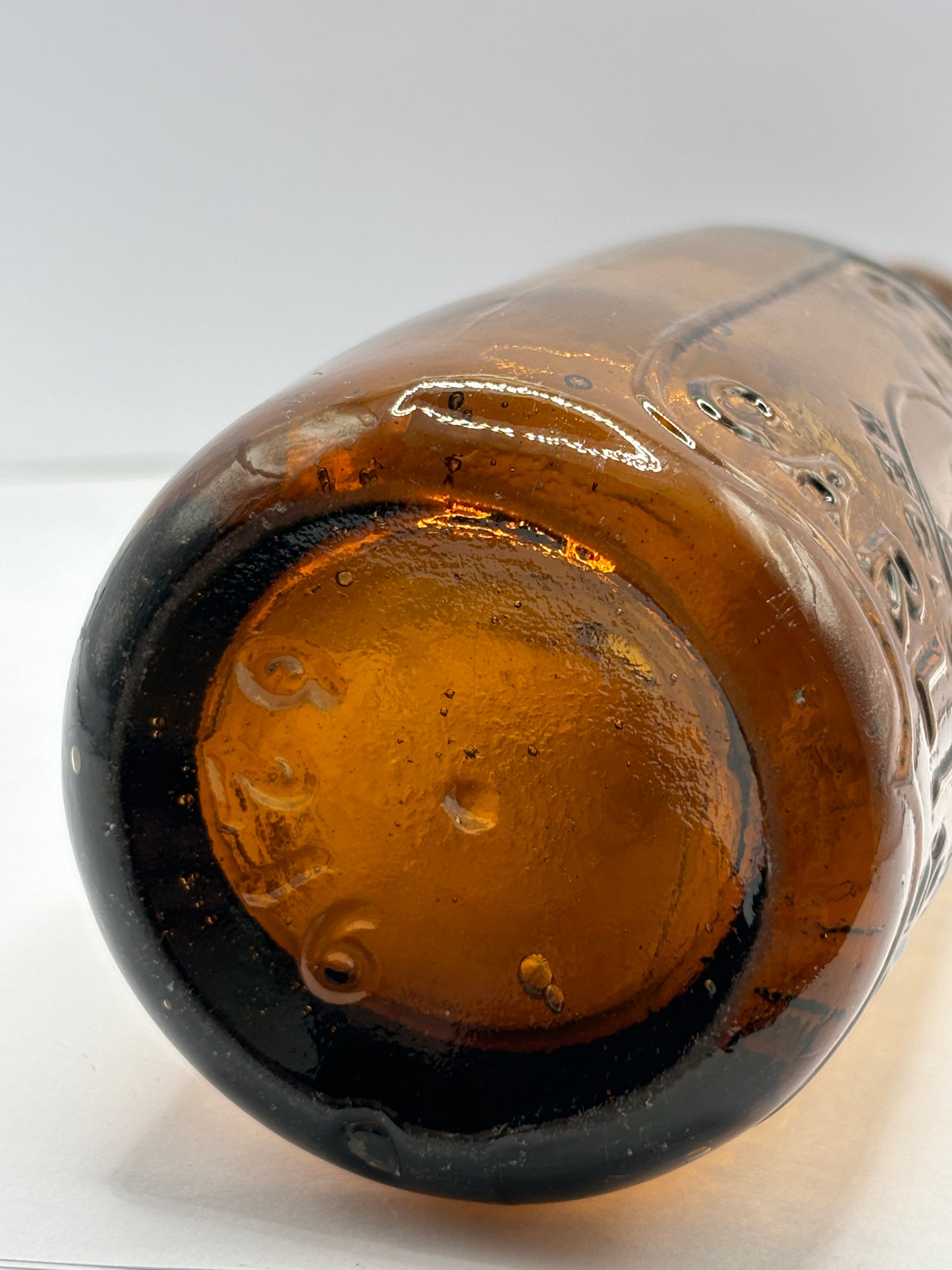 Old amber glass beer bottle, T&J minns Carlisle