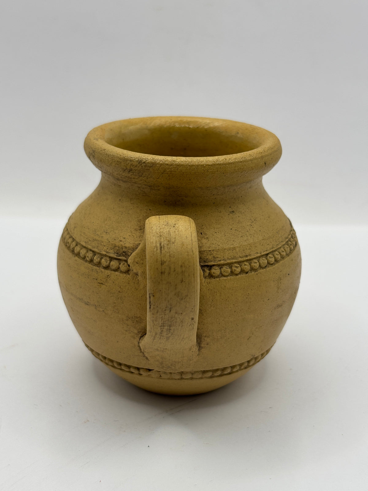Old stained stoneware handled jug