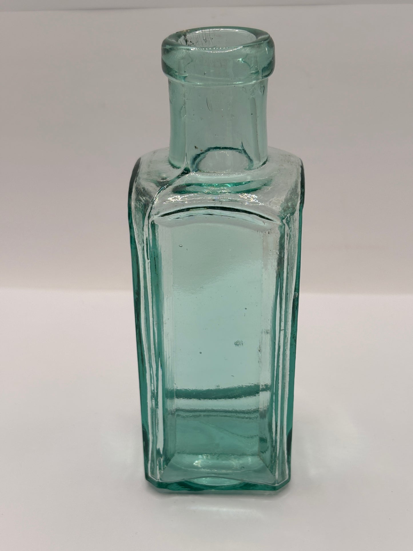 Old square aqua glass chemist bottle