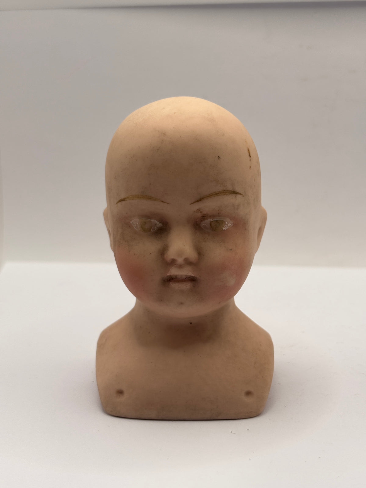 Old dolls head 9cms