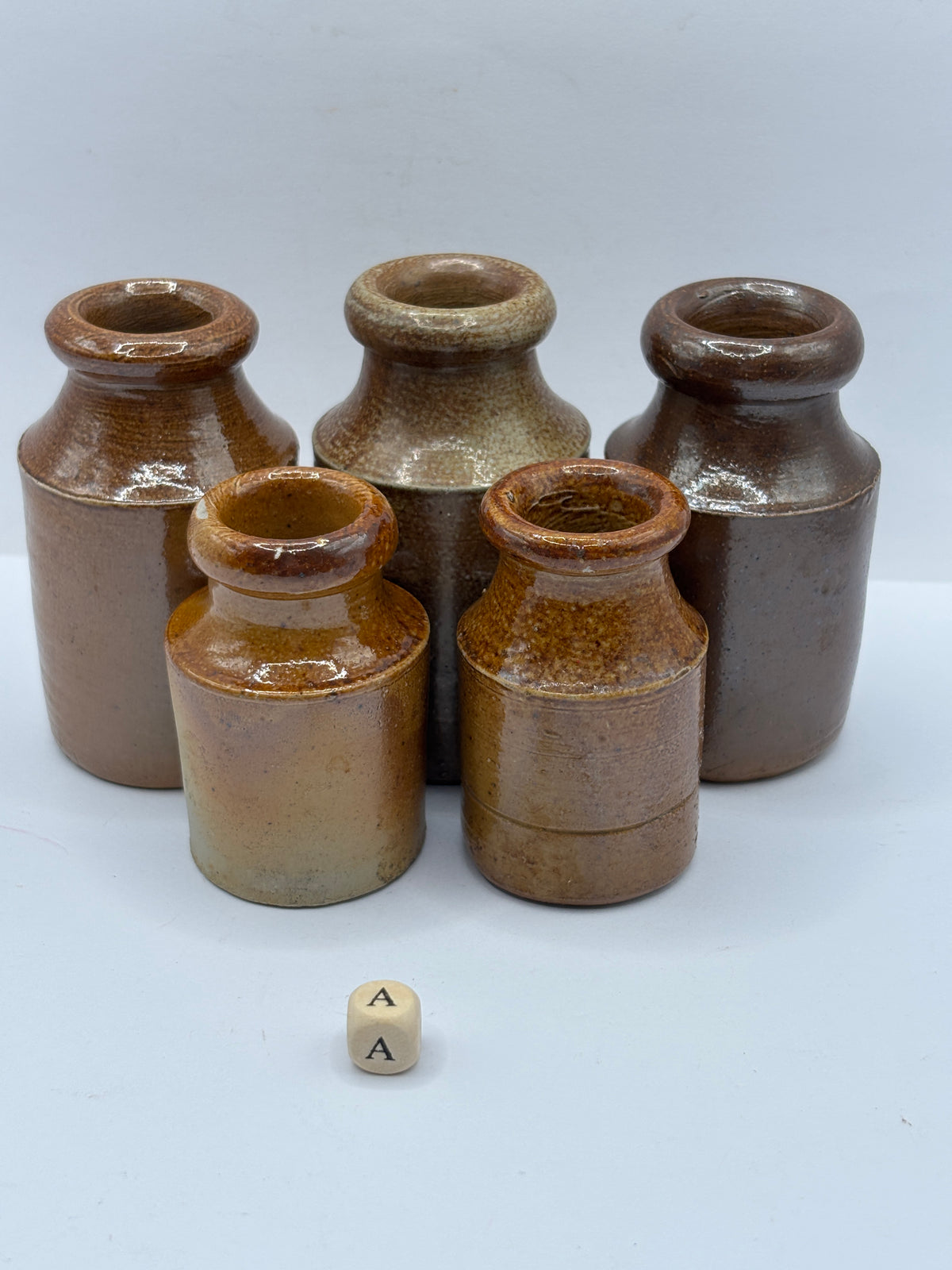 5 small brown stoneware pots (a)