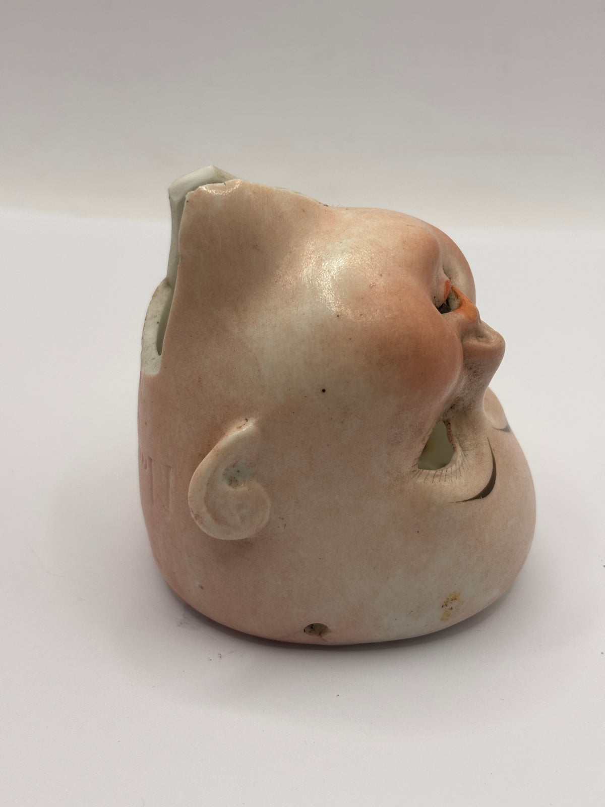 Old bisque dolls head, damaged
