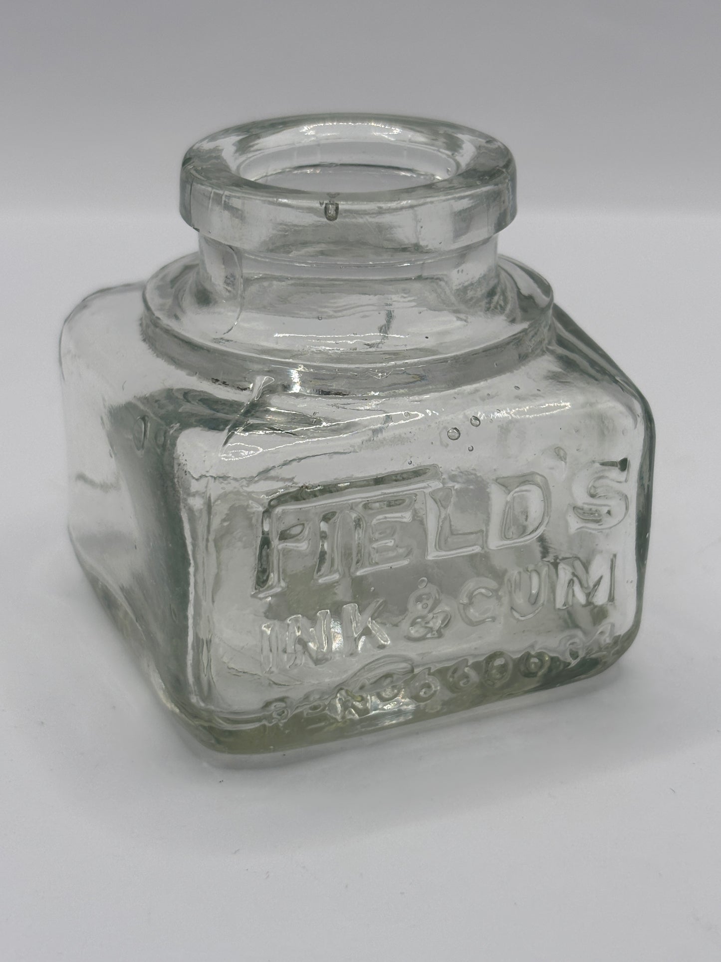 Old clear glass advertising inkwell, ink bottle. Fields ink