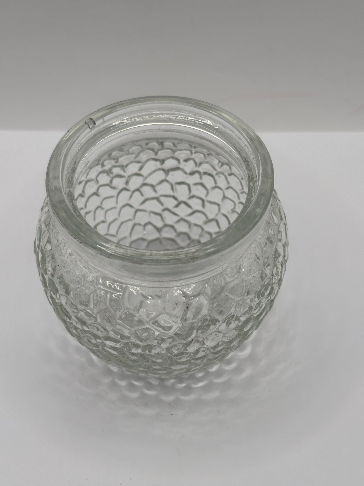 Old clear glass honey jar