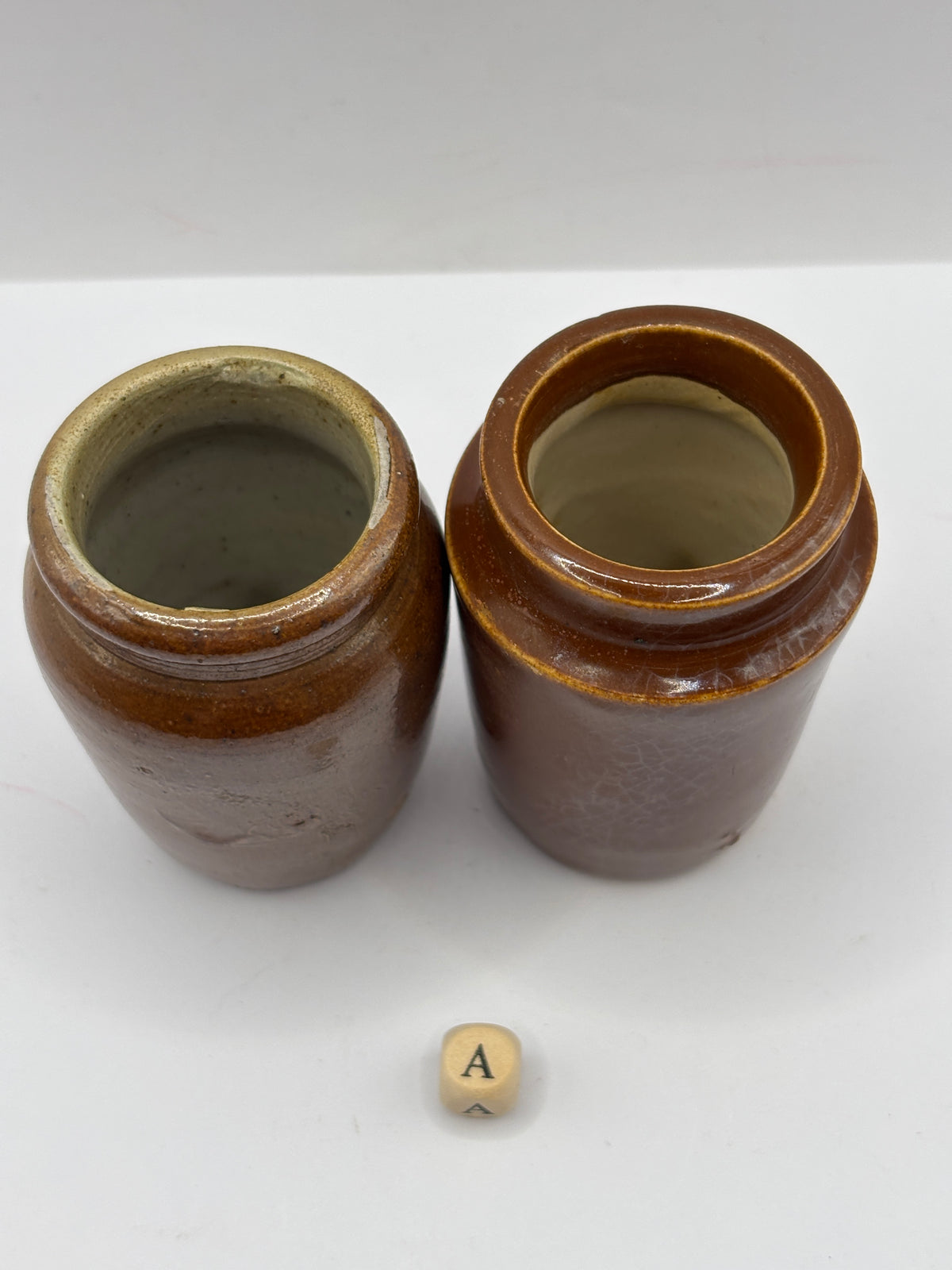 2 Old brown stoneware cream pots (a)