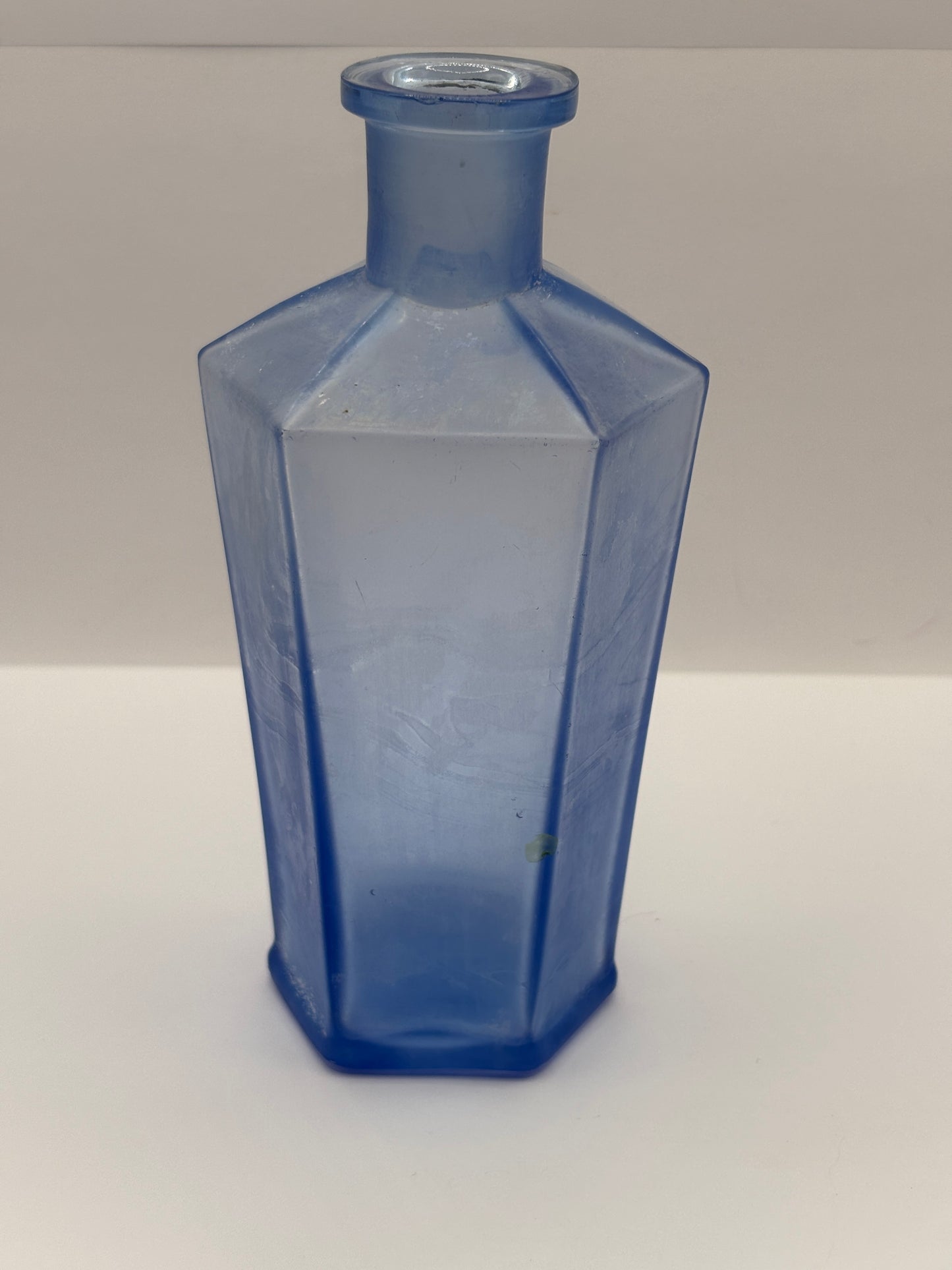 Old unusual blue glass bottle. 6 sided