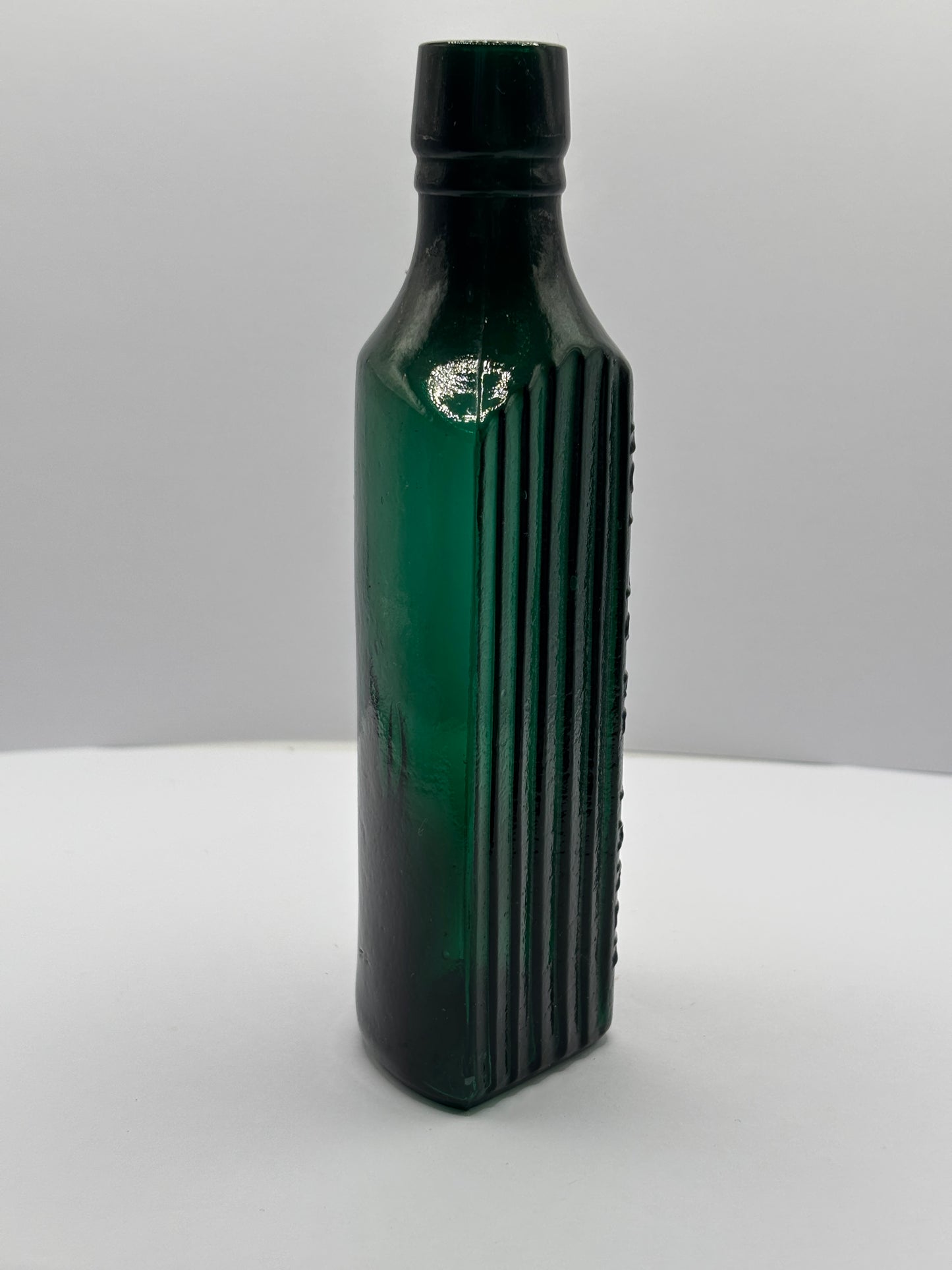 Old green glass poison bottle, not to be taken
