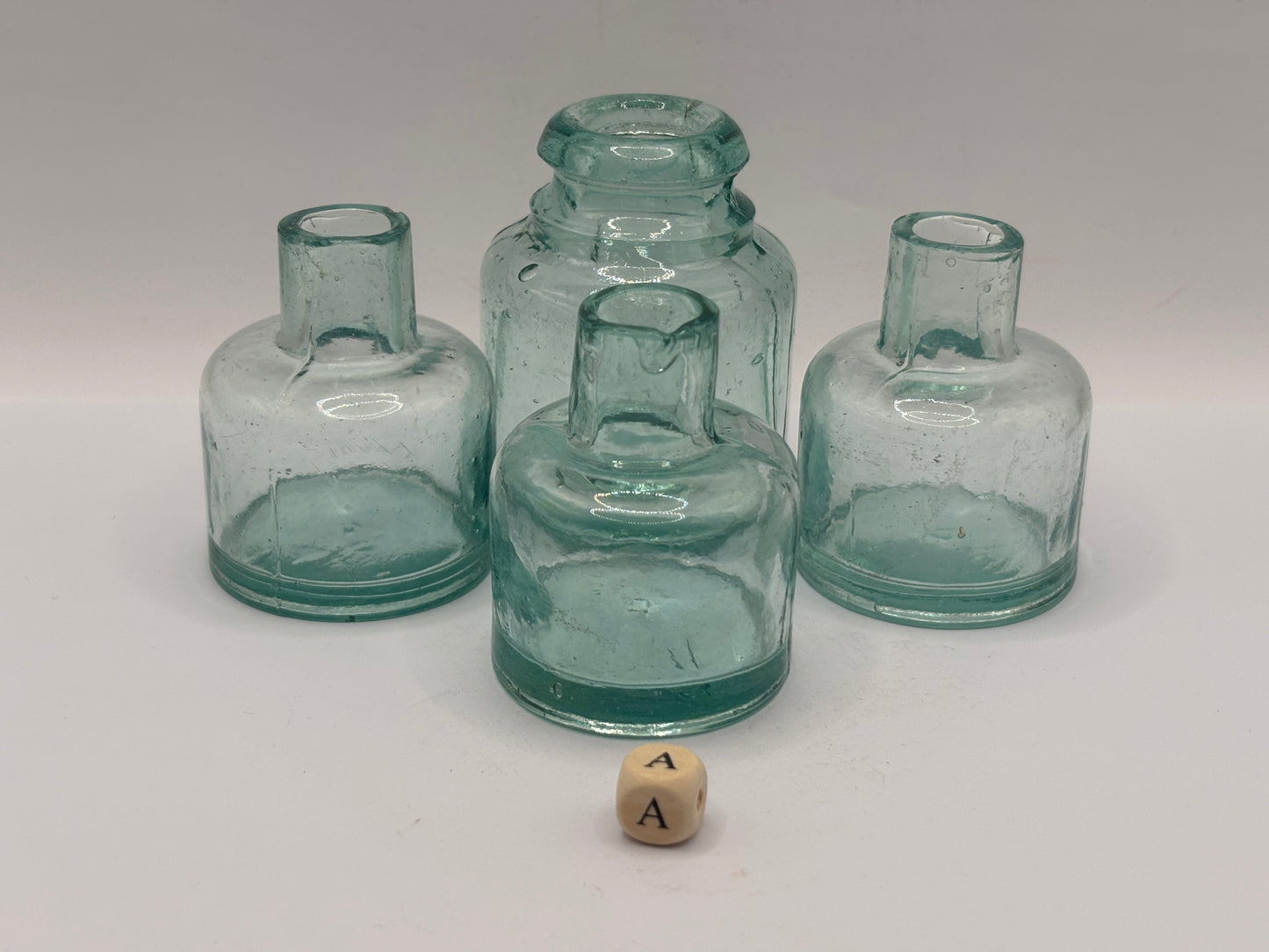 4 old aqua glass inks, inkwells, ink bottles, smooth top (a)