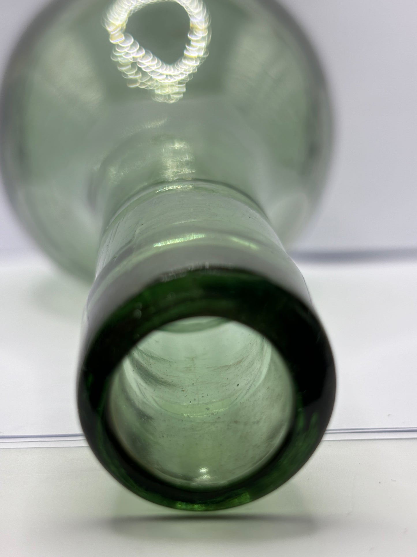 Old round bottom aqua glass bottle