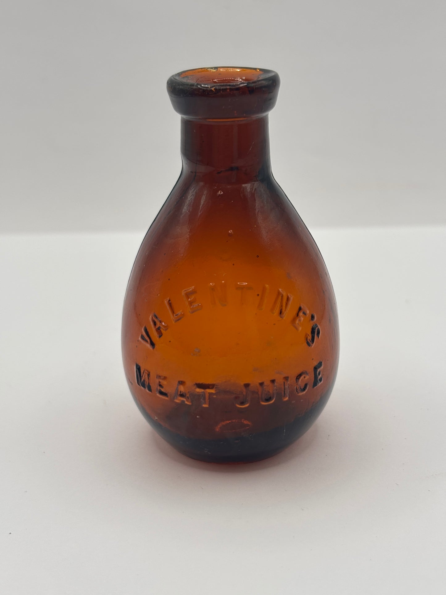 Old amber glass bottle, valentines meat juice