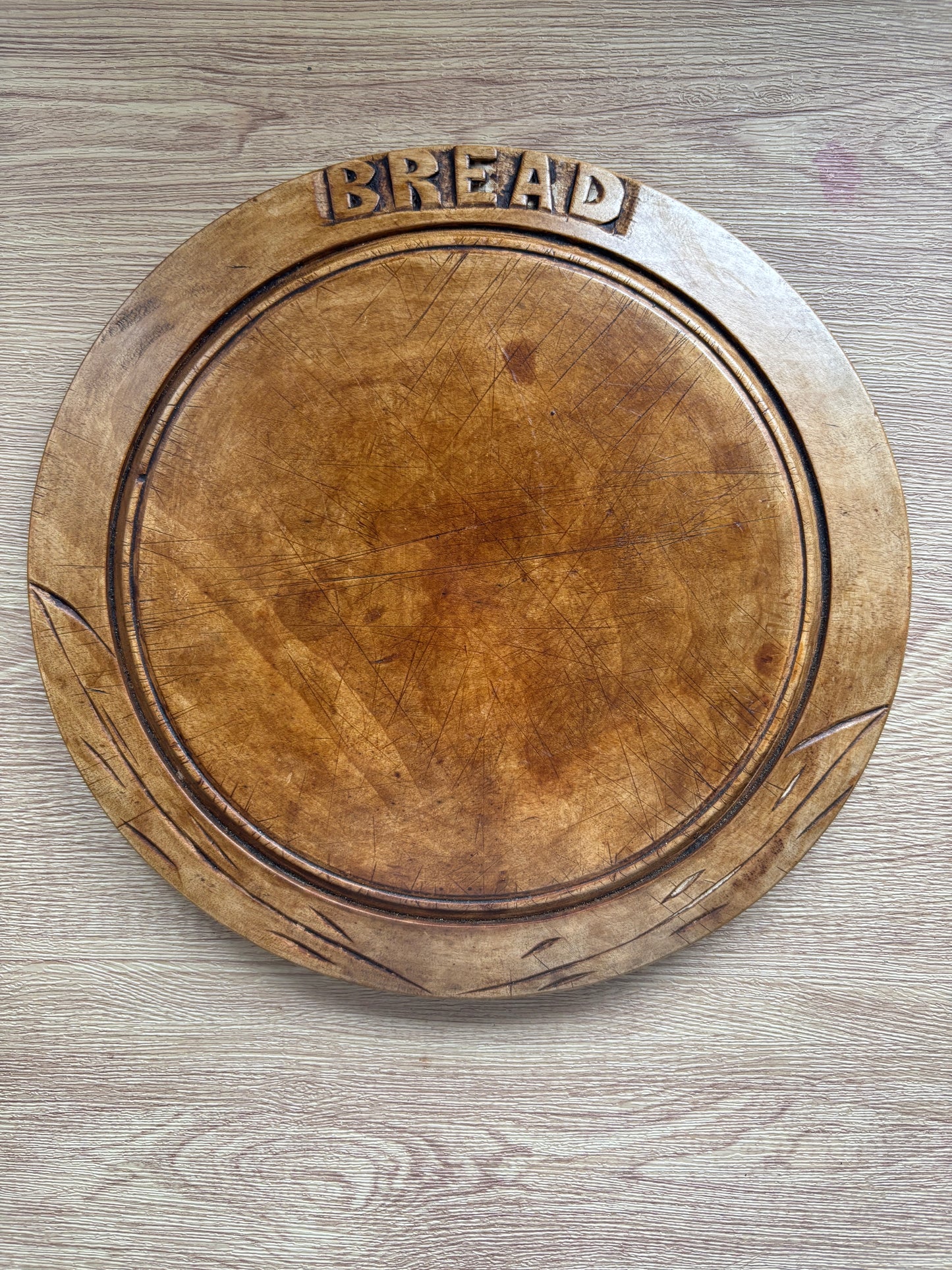 Old wooden carved bread board