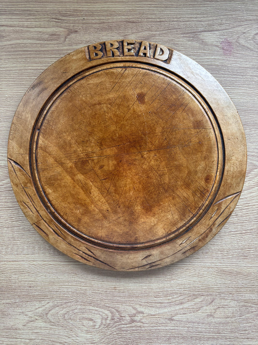 Old wooden carved bread board