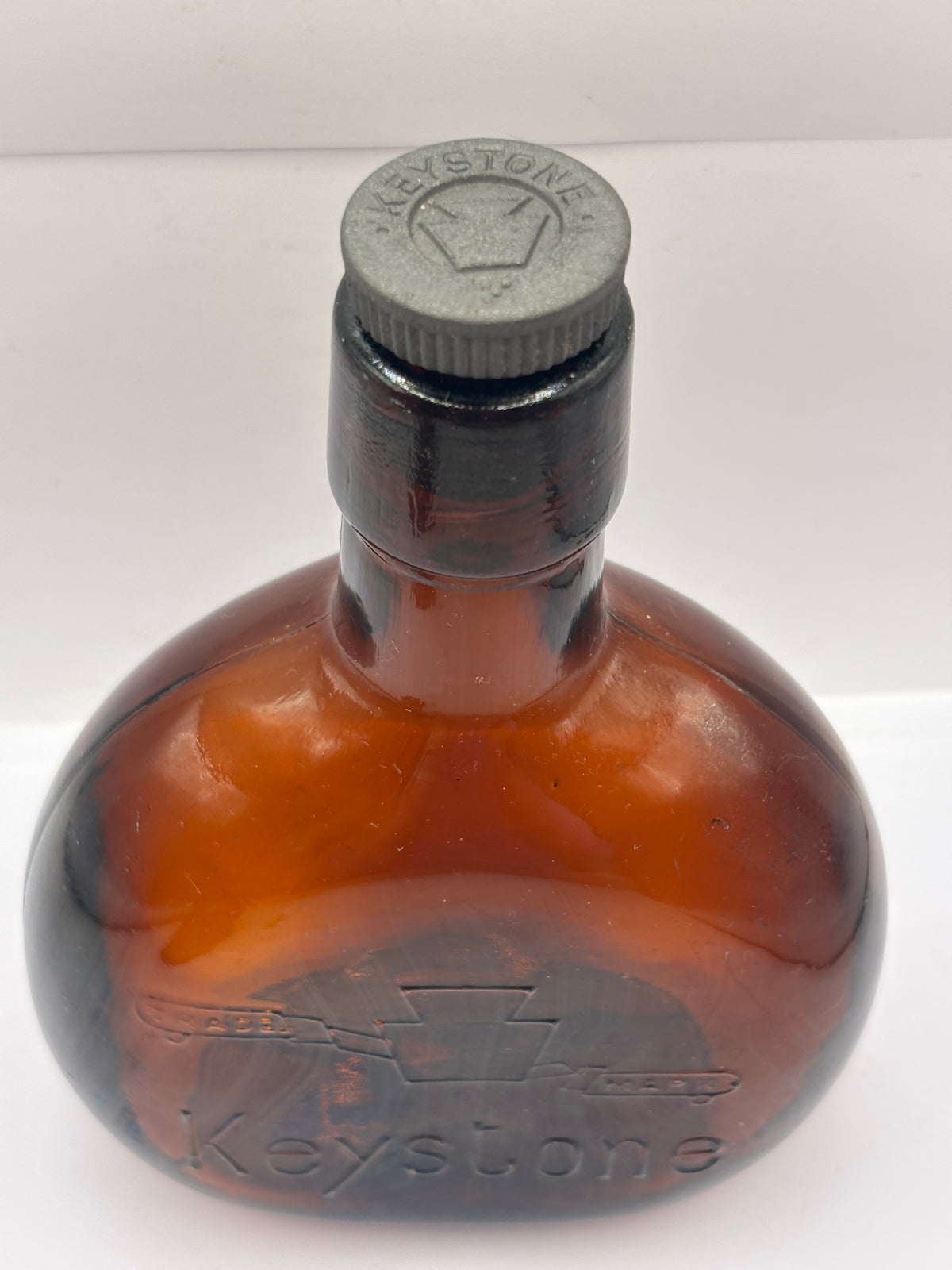Old amber glass bottle with original stopper