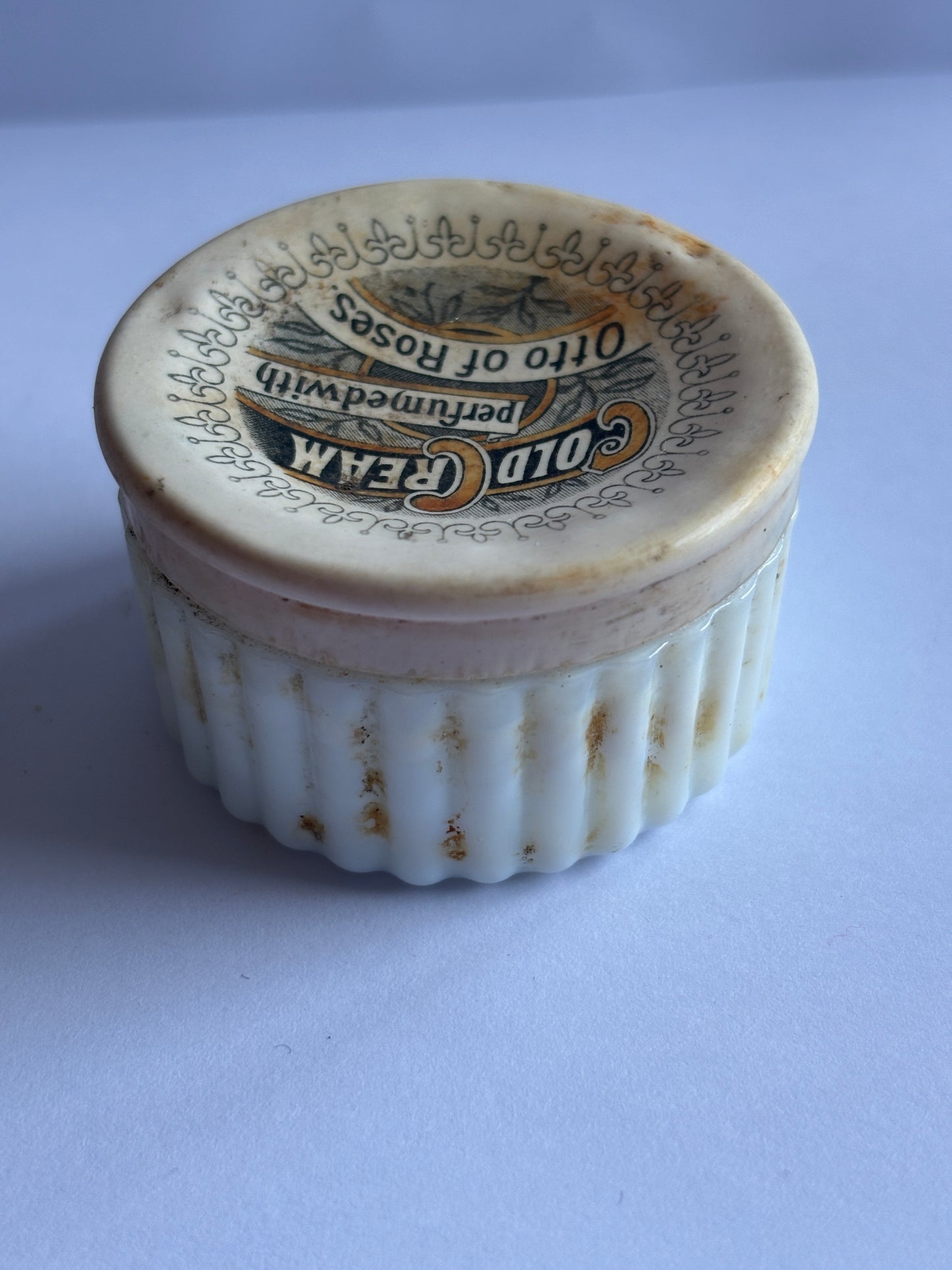 Old cold cream lid and base