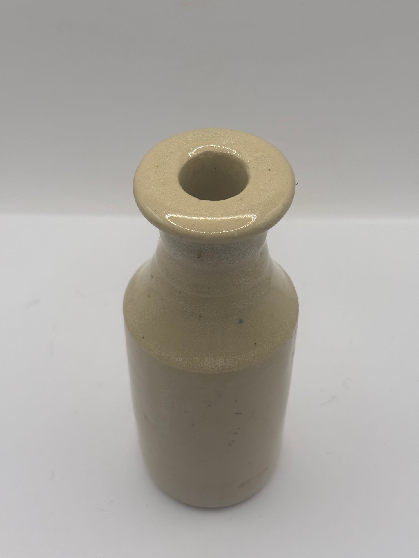 Old tall white stoneware bottle, ink? Polish?