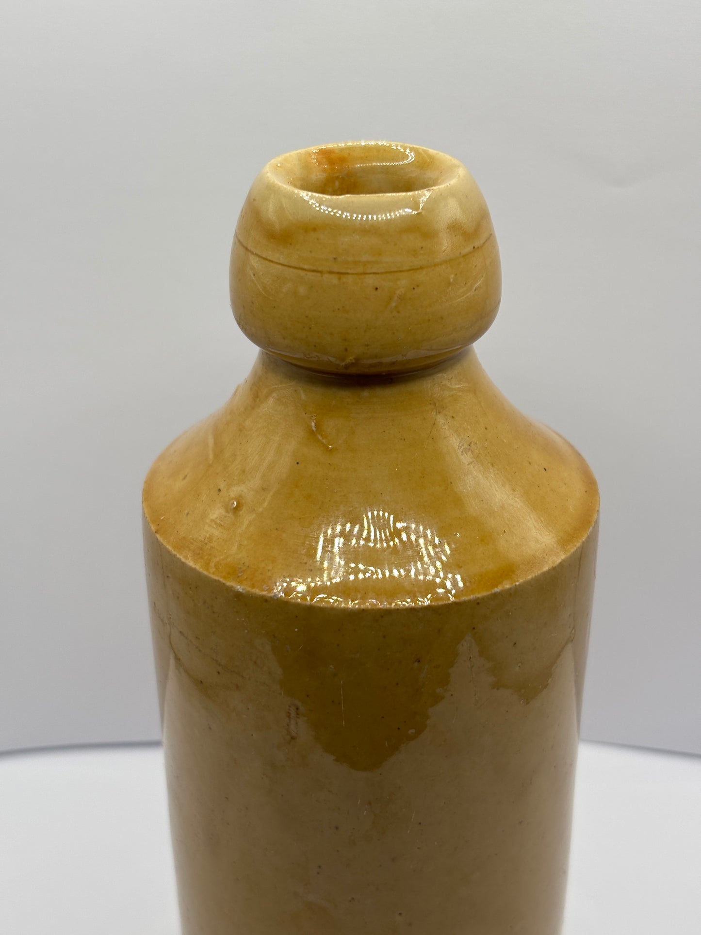 Old impressed stoneware ginger beer bottle, J.H Cuff Manchester
