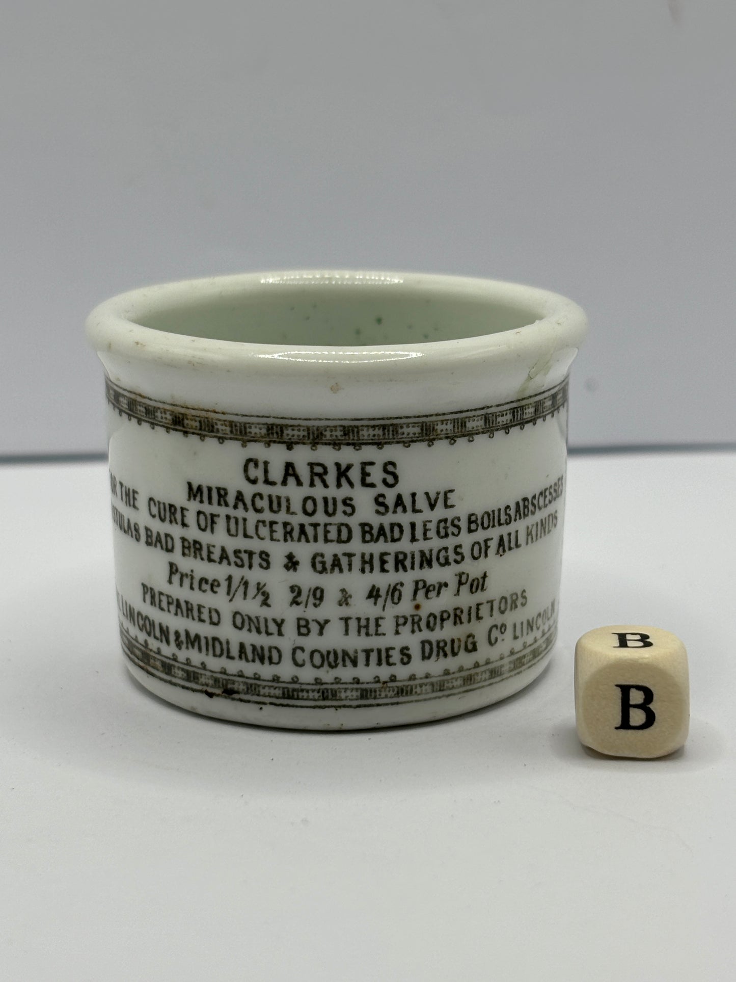 Small Clarke’s miraculous salve advertising ointment pot (b)